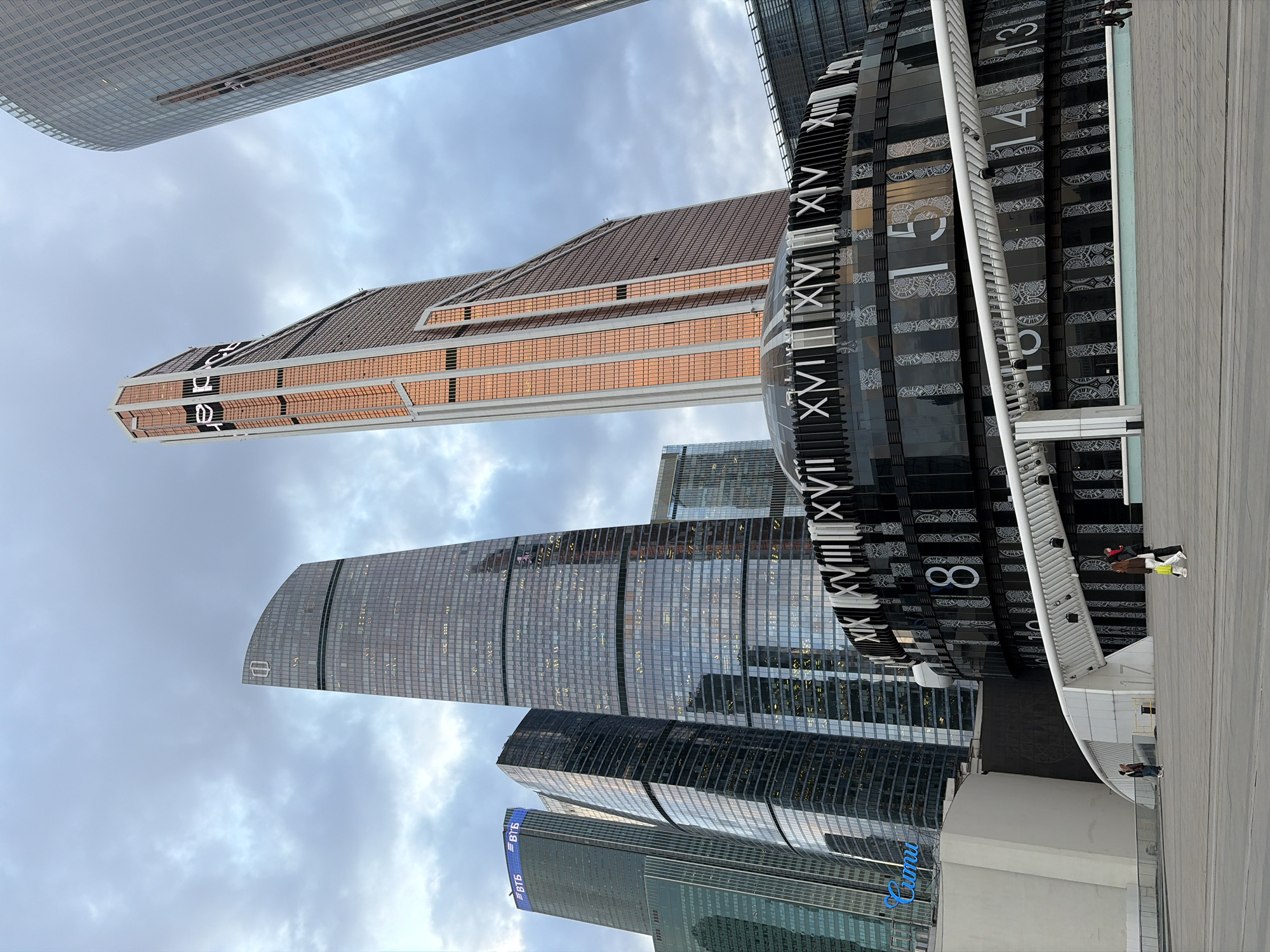 Modern skyscrapers and decorative clock photographed in Khimki, Russia