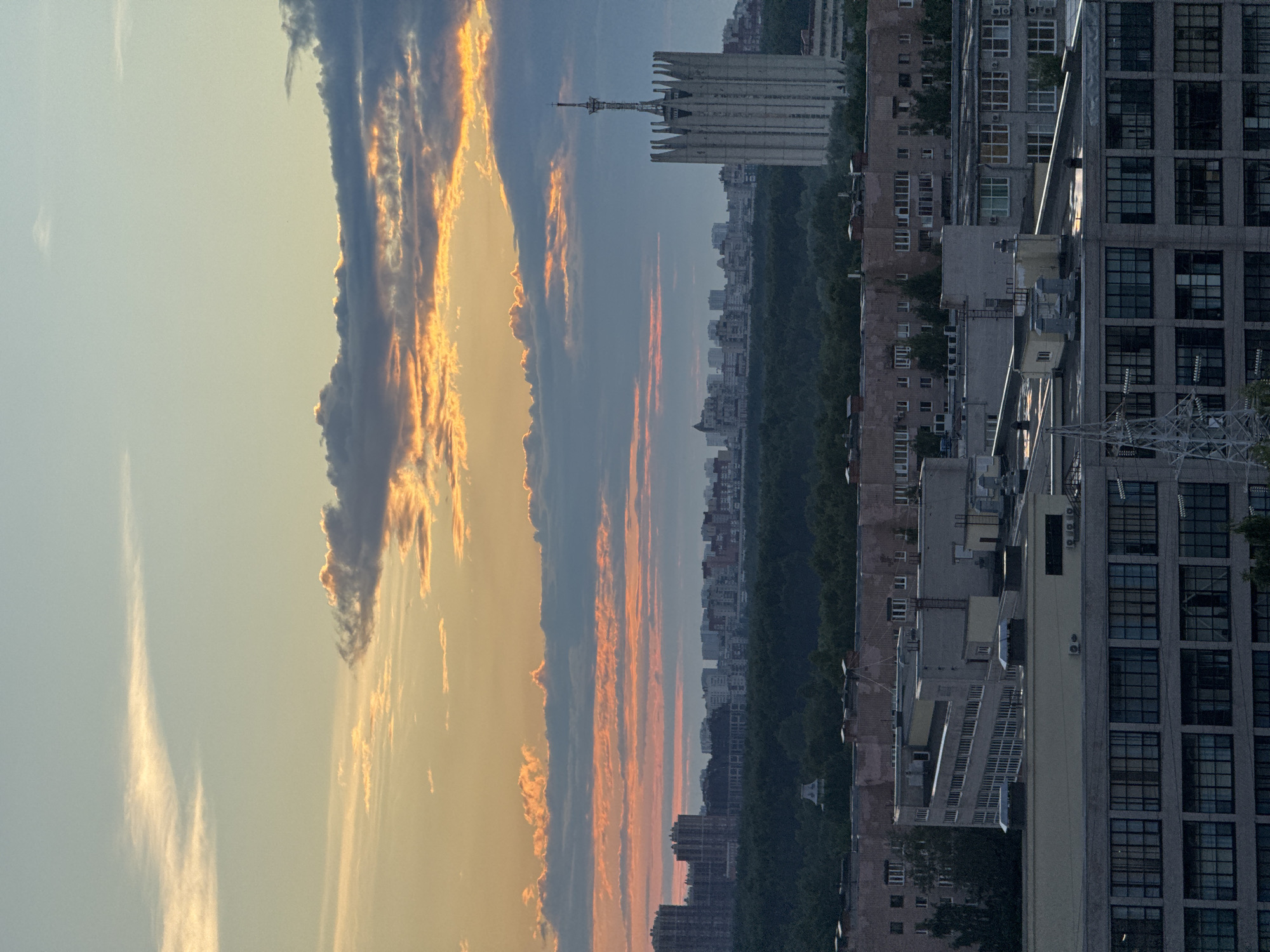 Russian city skyline under a dramatic sunset sky