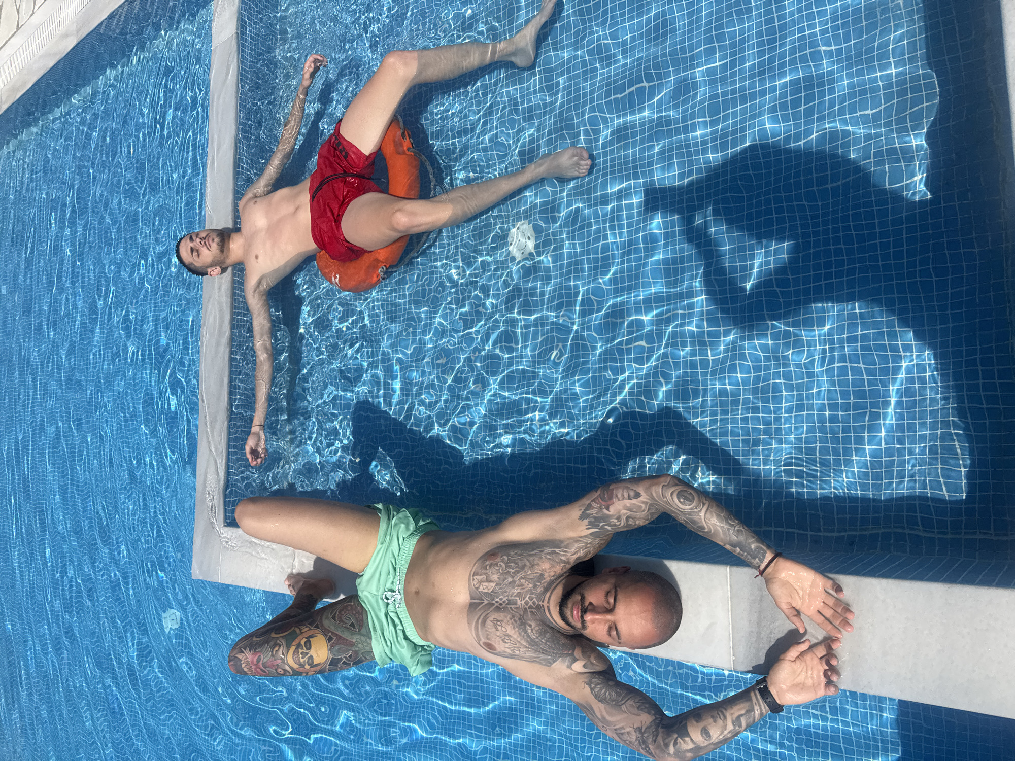 Poolside leisure captured with swimmers and relaxing dog in Lefkada