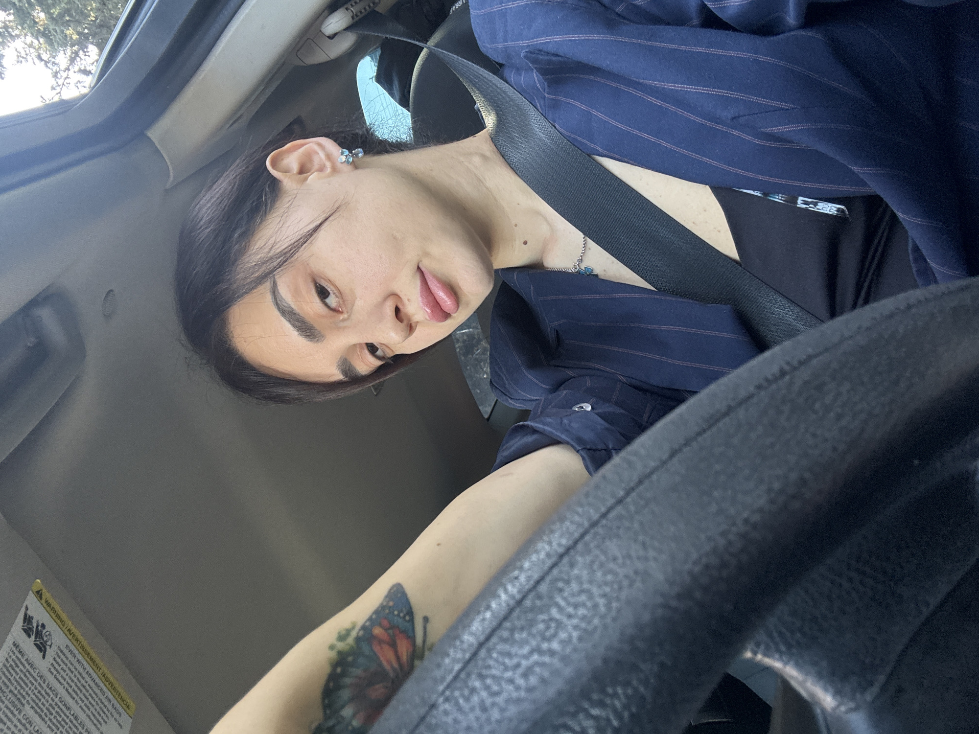 Woman makes playful face while driving in Tbilisi