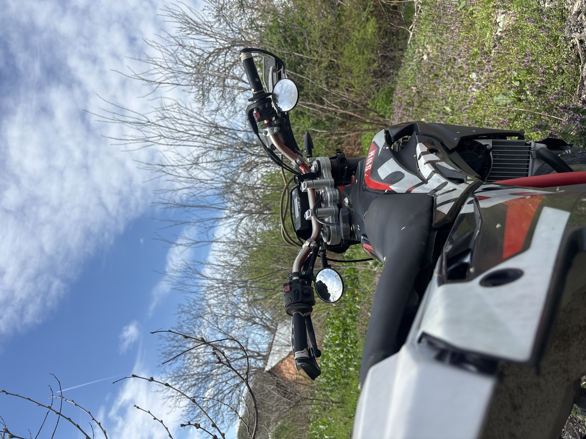 SWM motorcycle photographed in rural setting