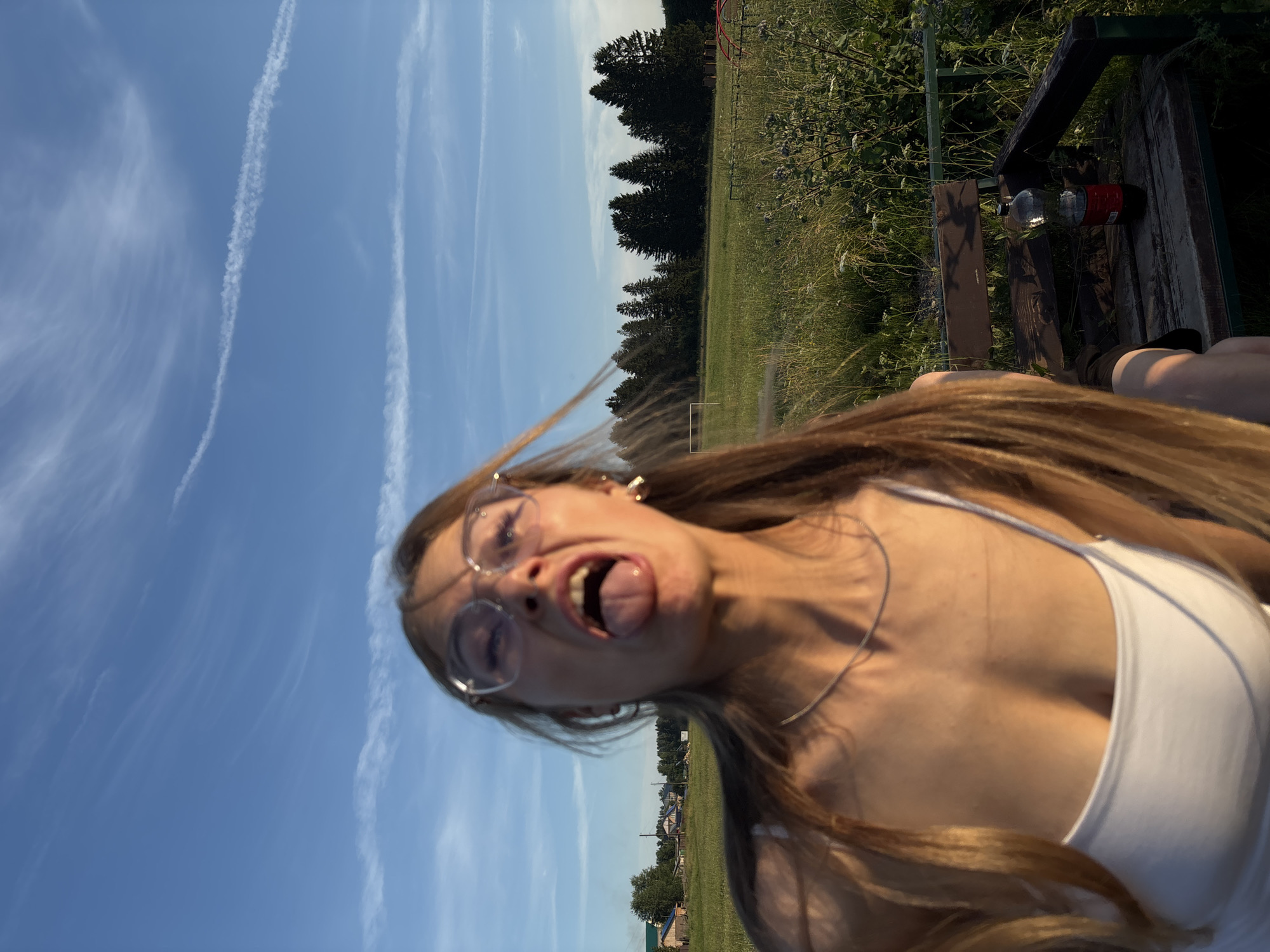 Summer afternoon at a rural playground and field in Фоки