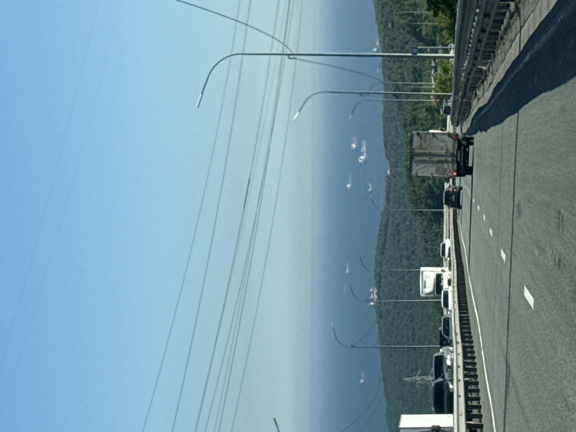 Morning traffic flows on elevated Vladivostok highway overlooking coastline