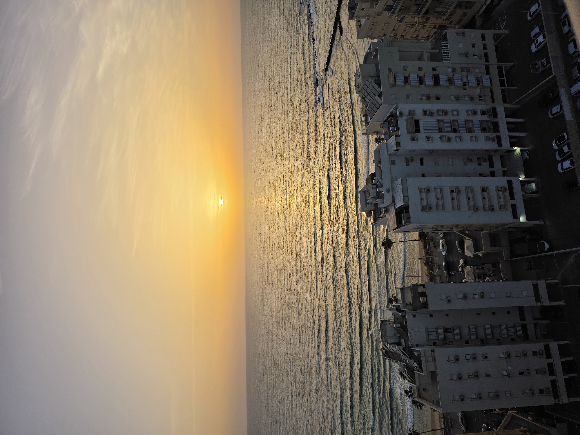 Beachgoers enjoy cloudy afternoon at Bat Yam, Israel coastline