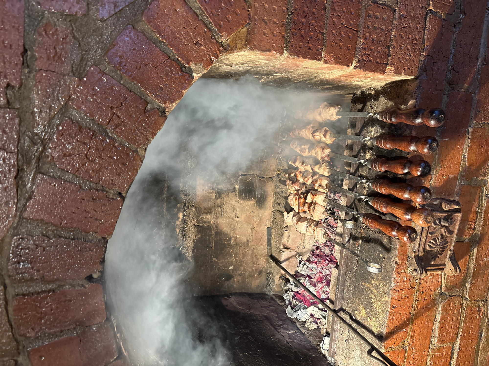 Rural cooking scene with brick oven in Алегазово, Russia