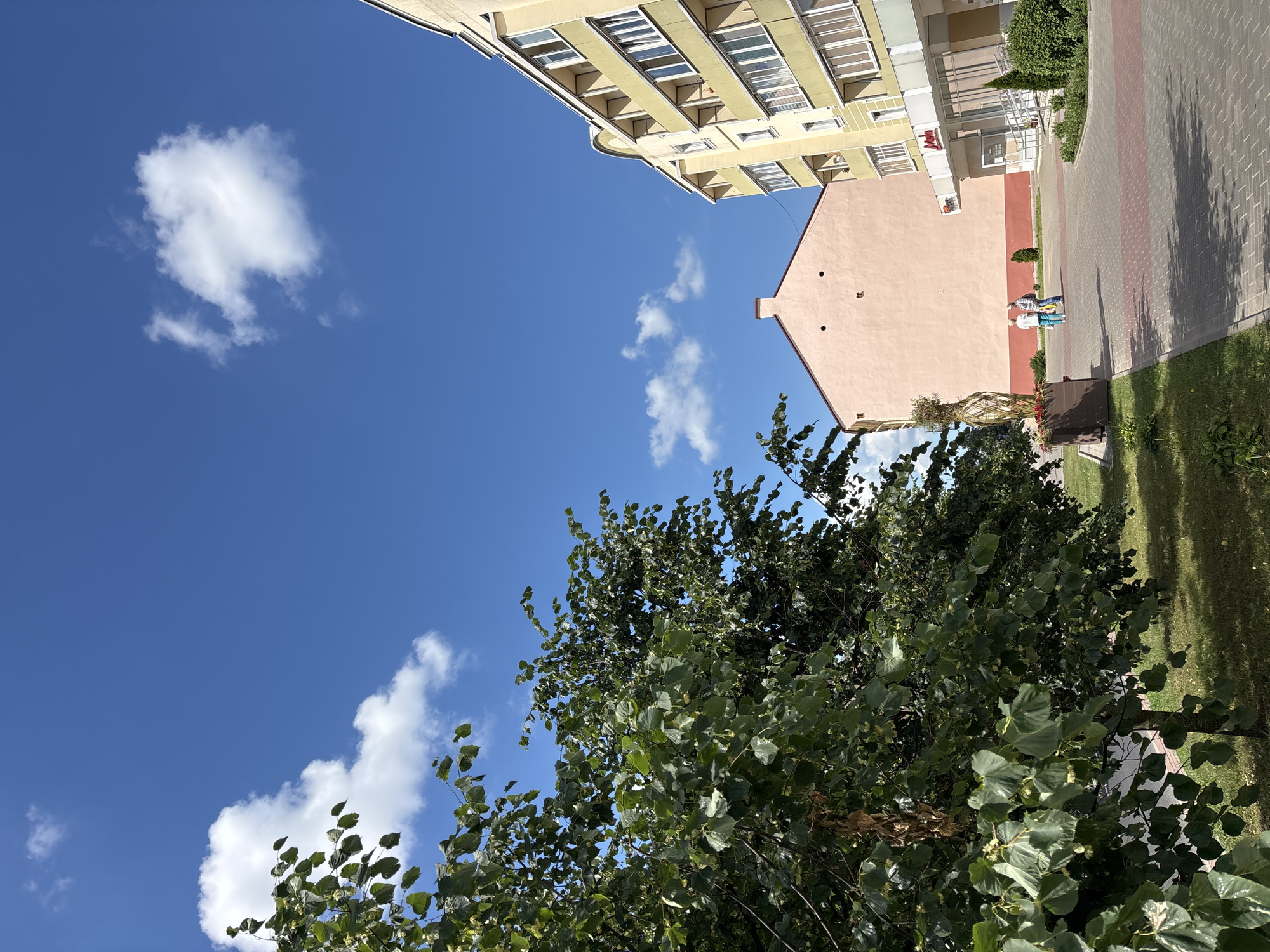 Street-level views of a Hrodna corner on a sunny morning