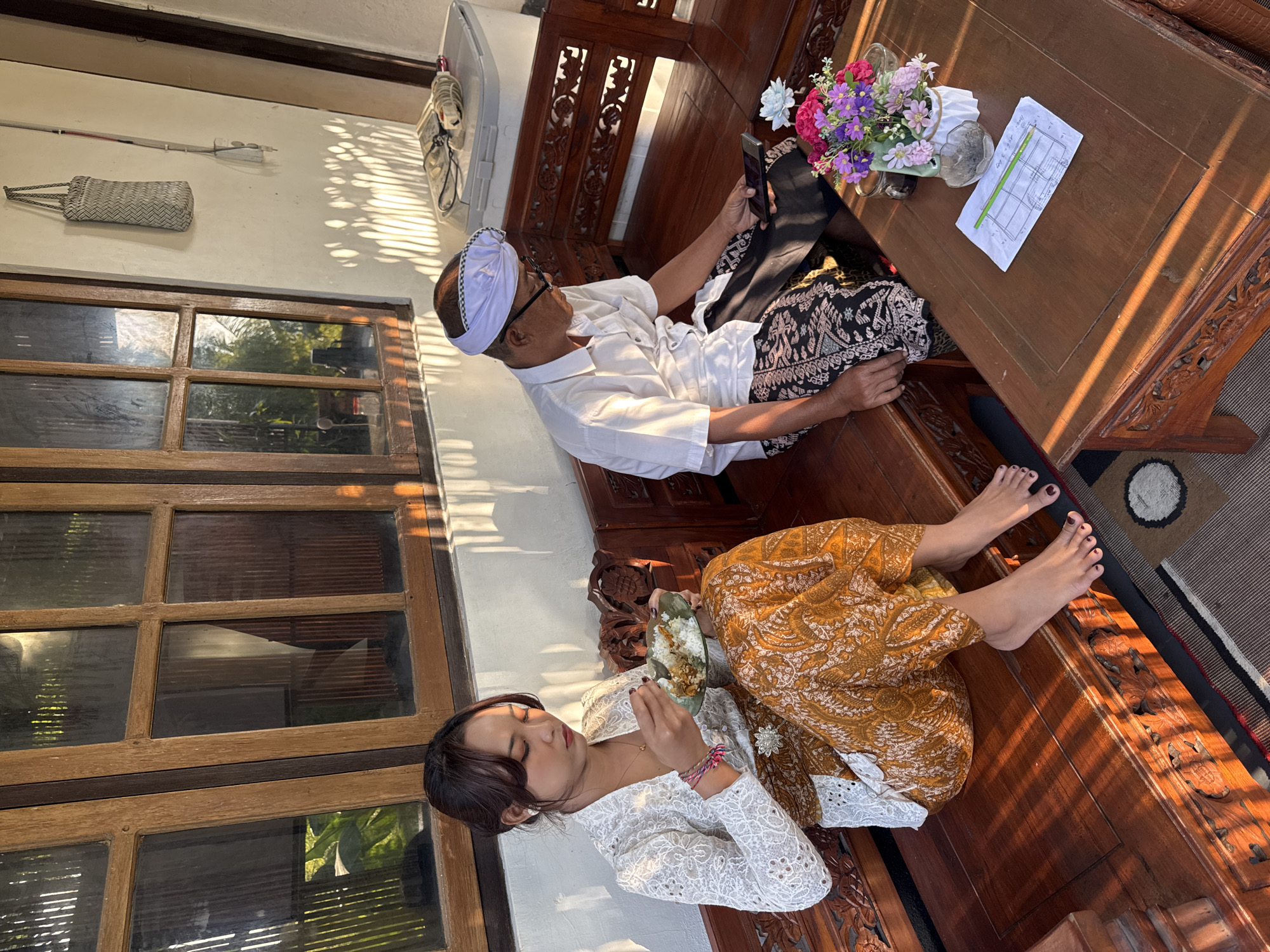 Morning gathering at a Sukasada home, traditional dress and food