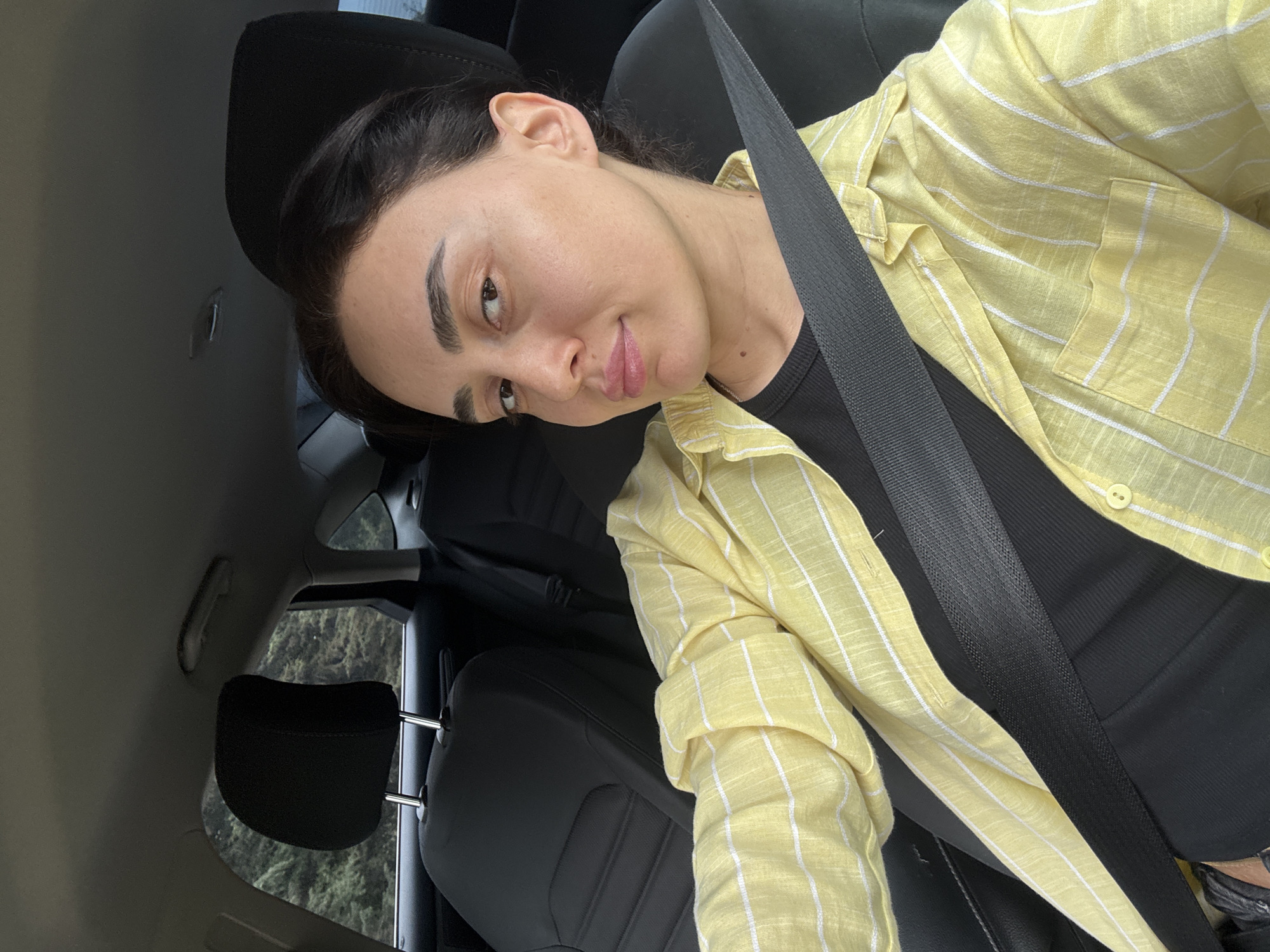 Woman takes selfie in car in Tbilisi