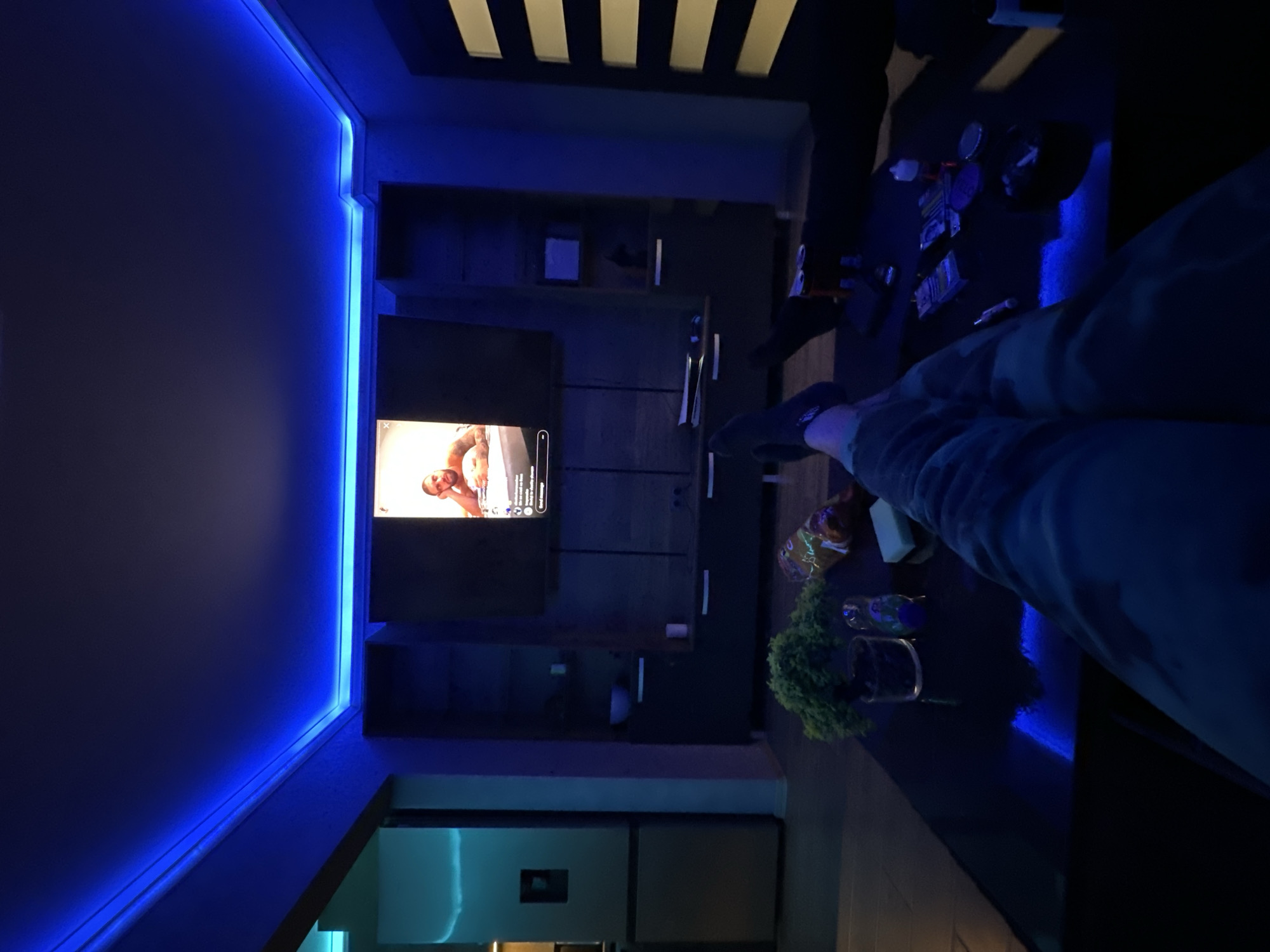 Person relaxes at home watching TV in Byala
