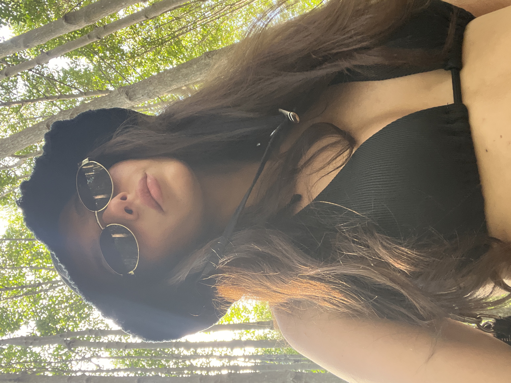 Woman photographed on elevated walkway through Phuket mangrove forest