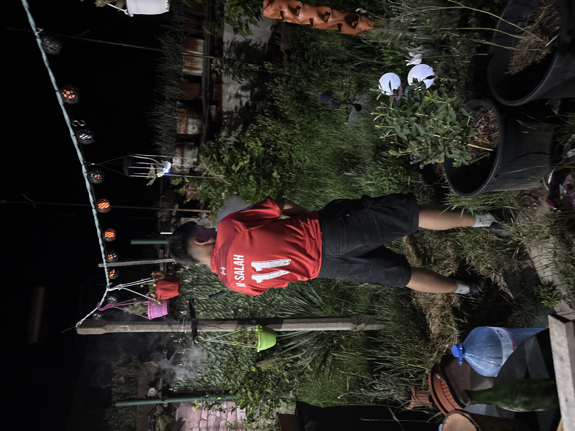 Young men gather for evening soccer viewing in Novi Iskar