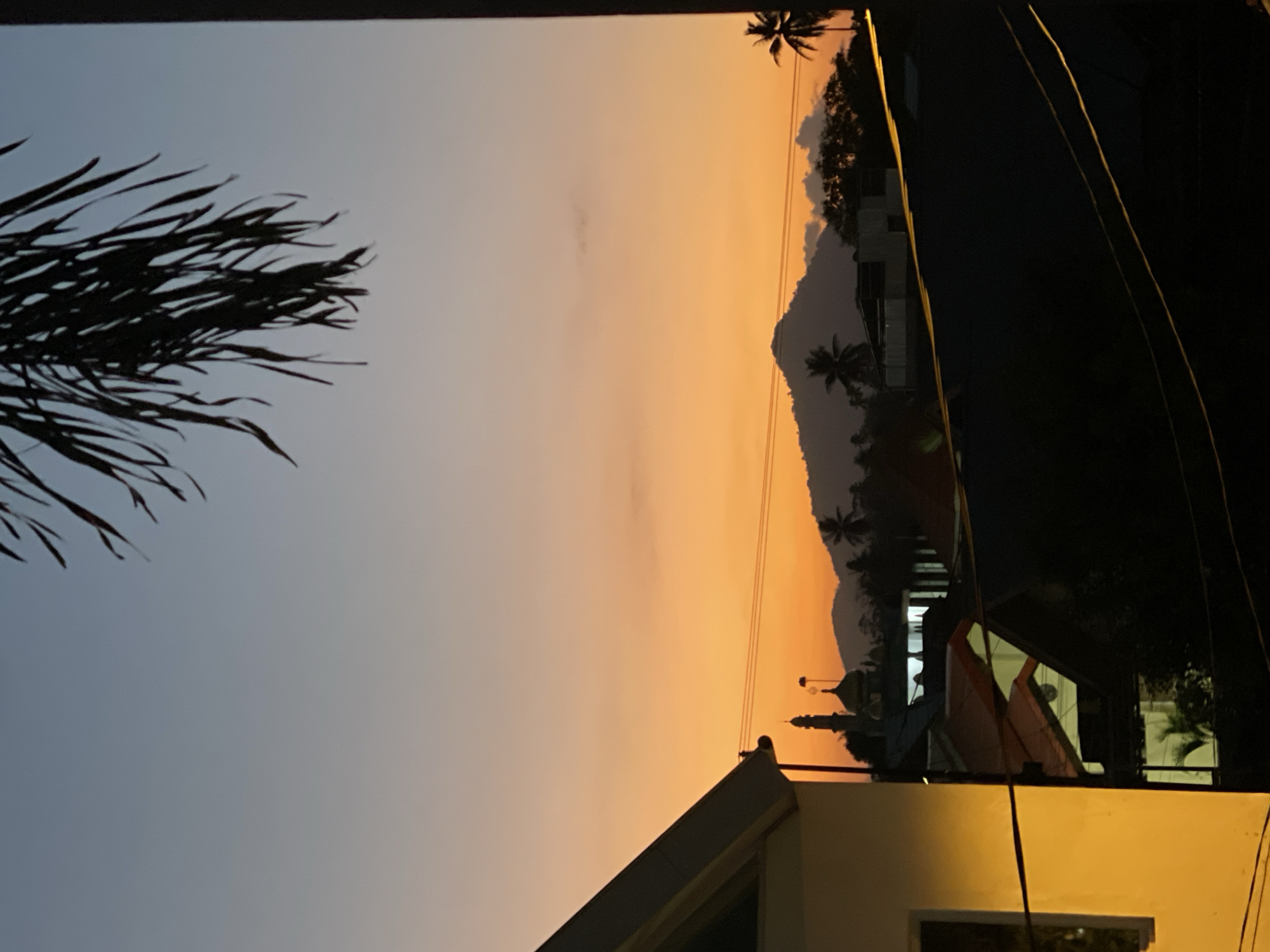 Golden hour silhouettes across the Manado skyline