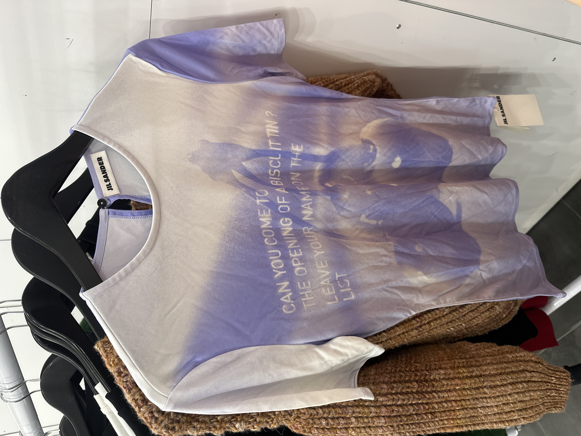 Designer t-shirt with cryptic biscuit tin message spotted in London