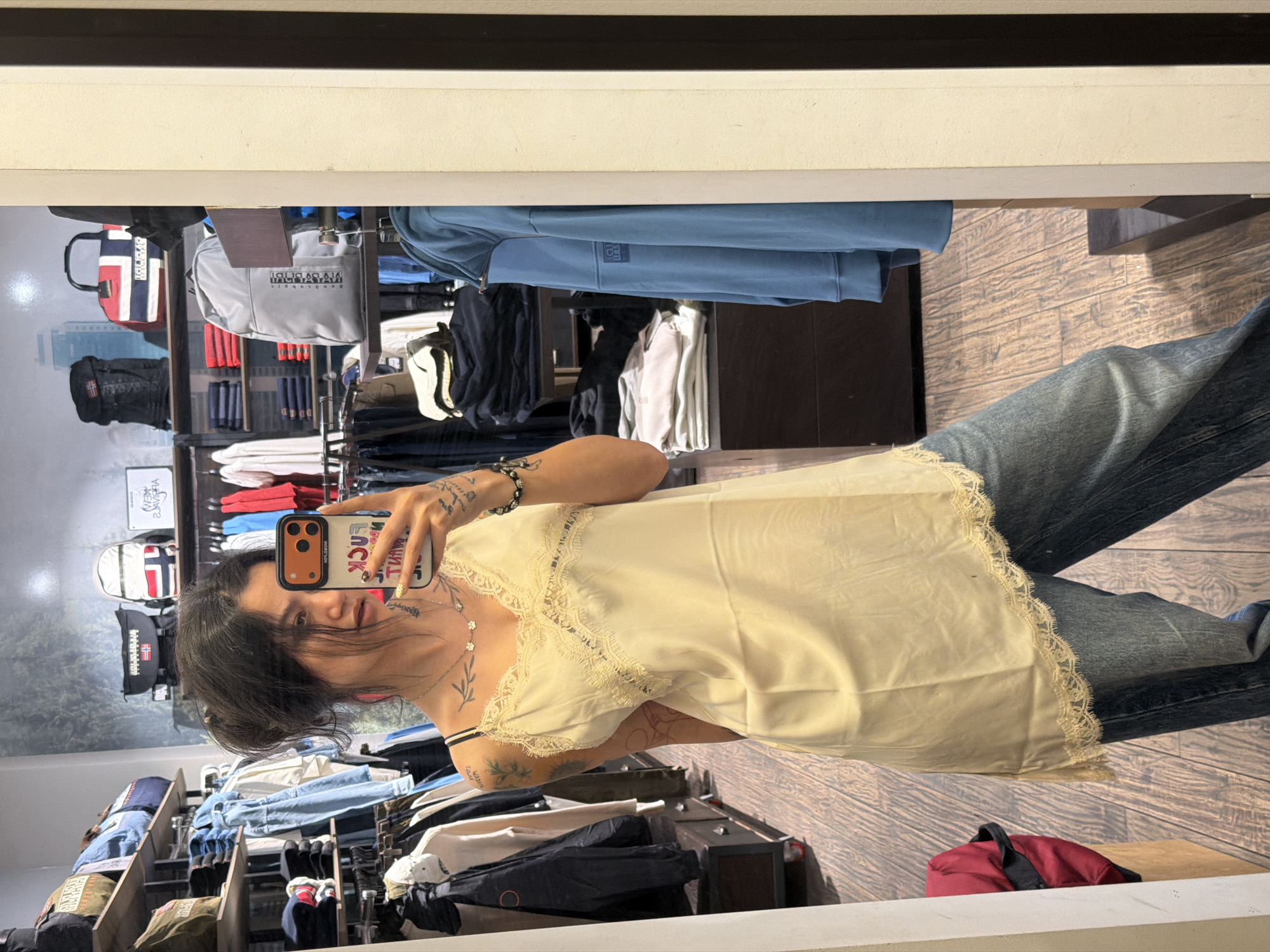 Woman takes mirror selfies while shopping in Sofia store