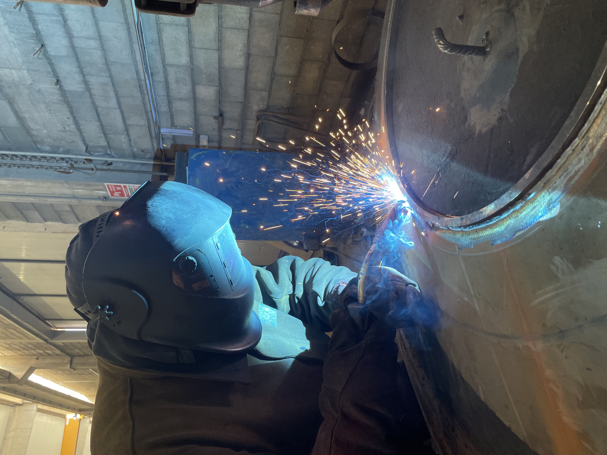 Early morning welding work observed at Zaljevo industrial workshop