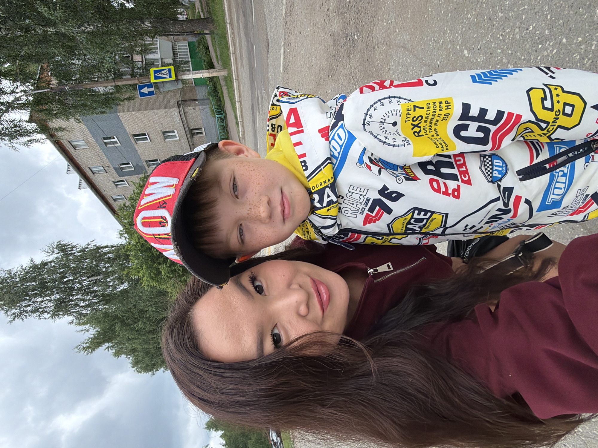 Outdoor selfie in Chaikovsky featuring a colorful racing-print jacket