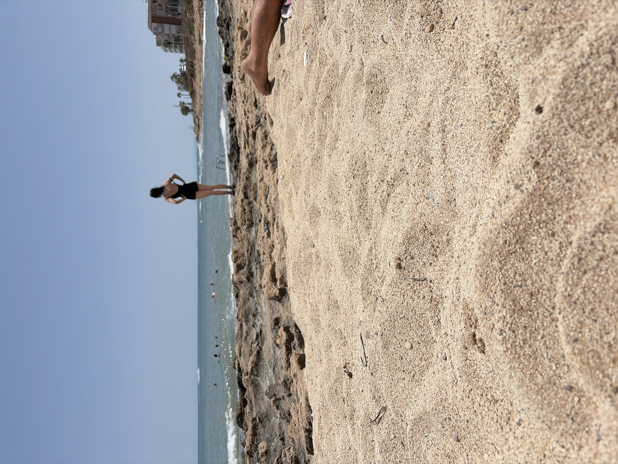 Sunny afternoon at Torrevieja's rocky Mediterranean shoreline