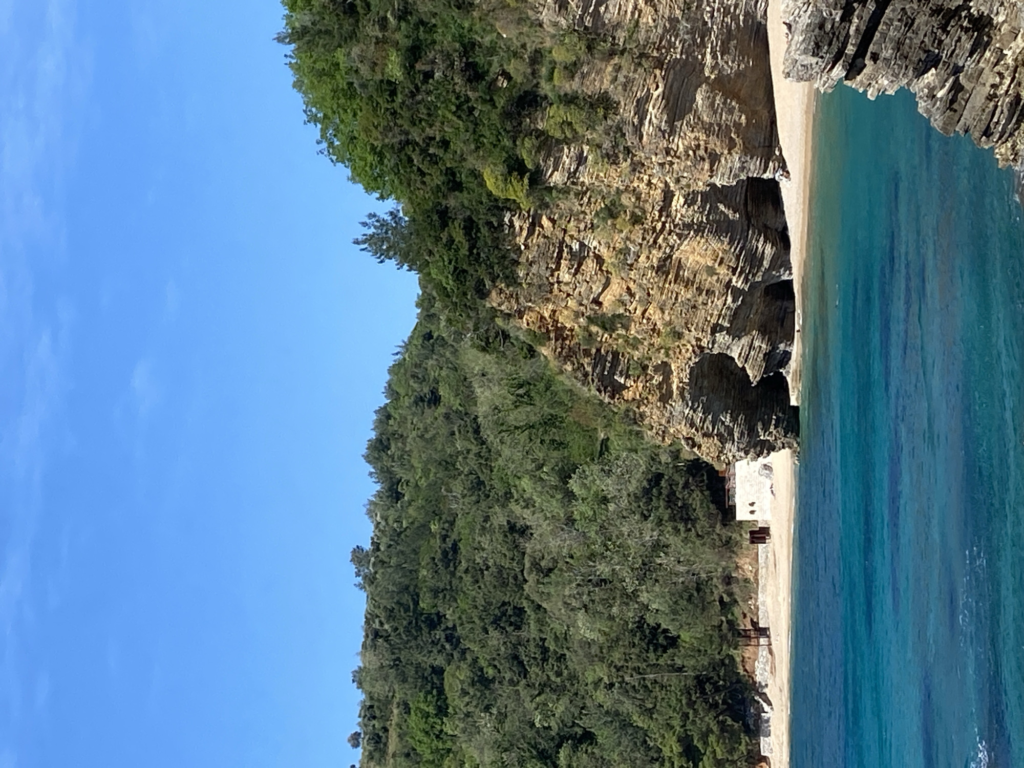 Woman photographed resting in coastal rock formation, Budva Montenegro