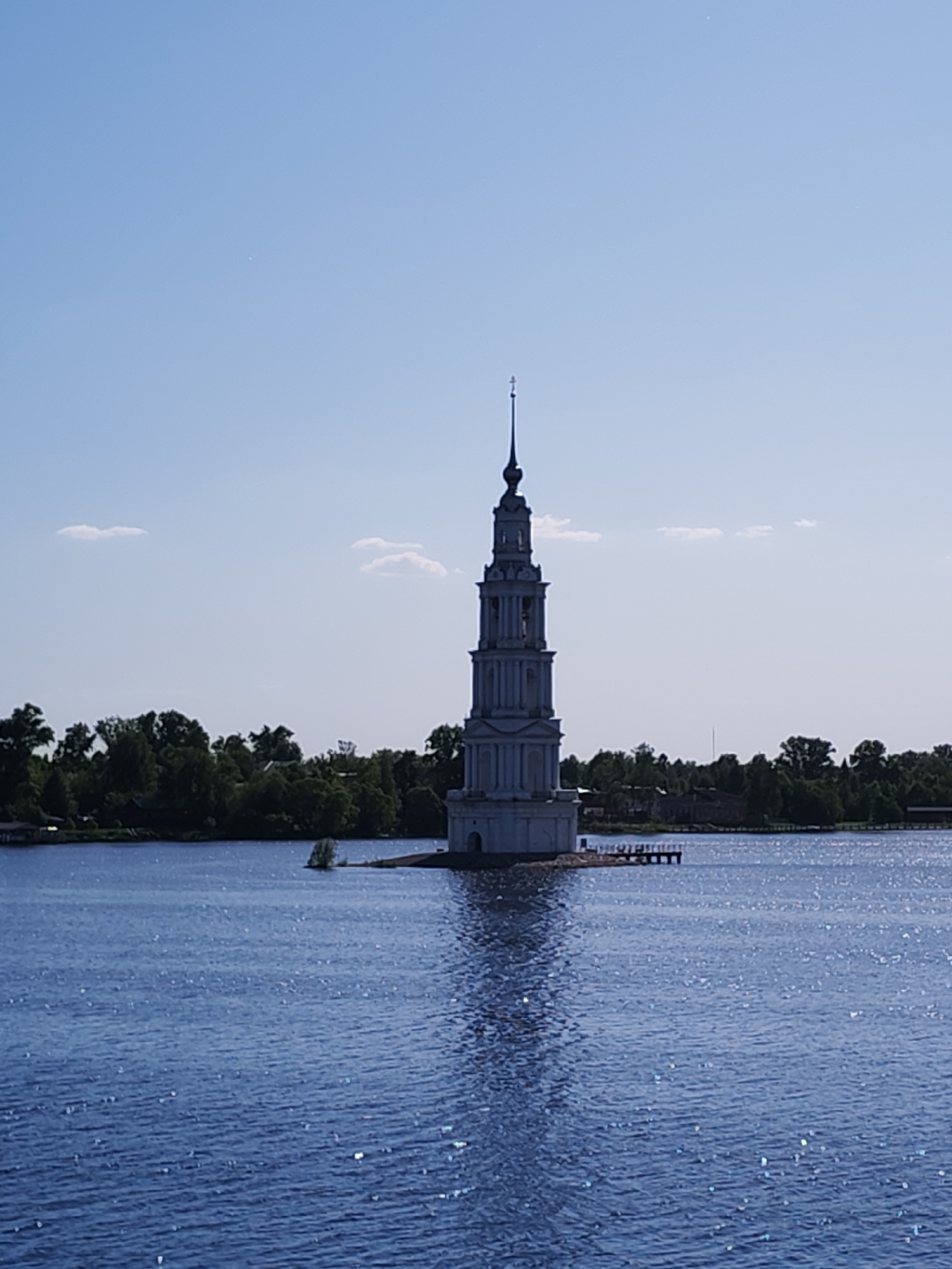 Tourist documents historic flooded bell tower from barge in Russia