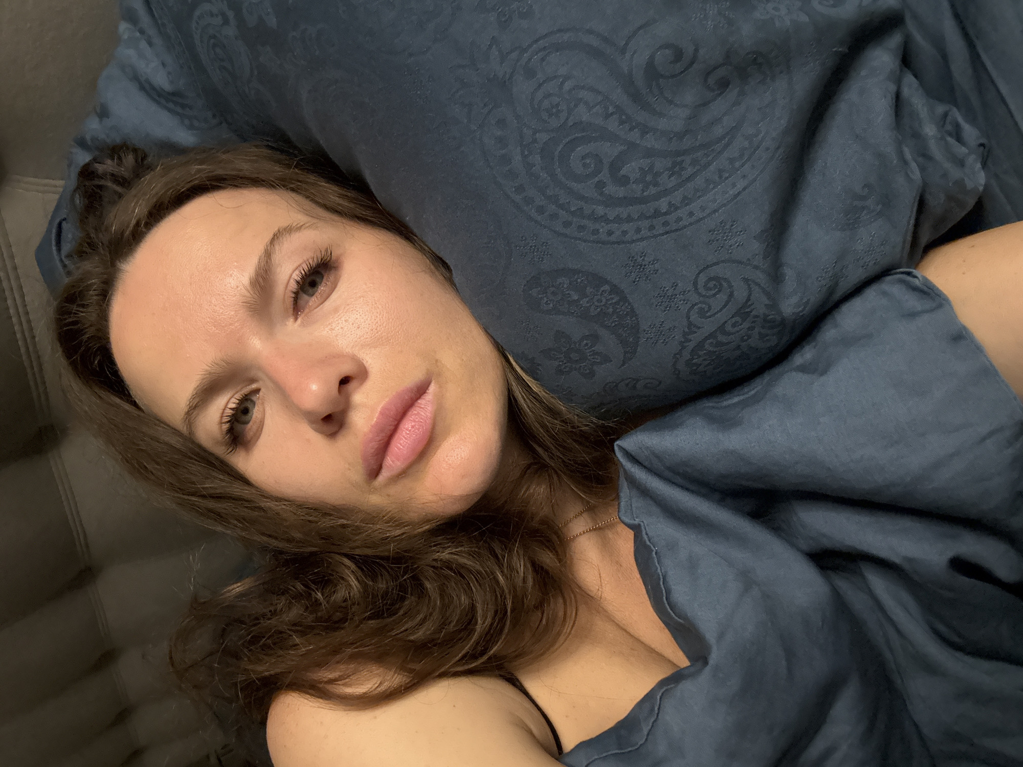 Woman rests on sofa in Khimki residence