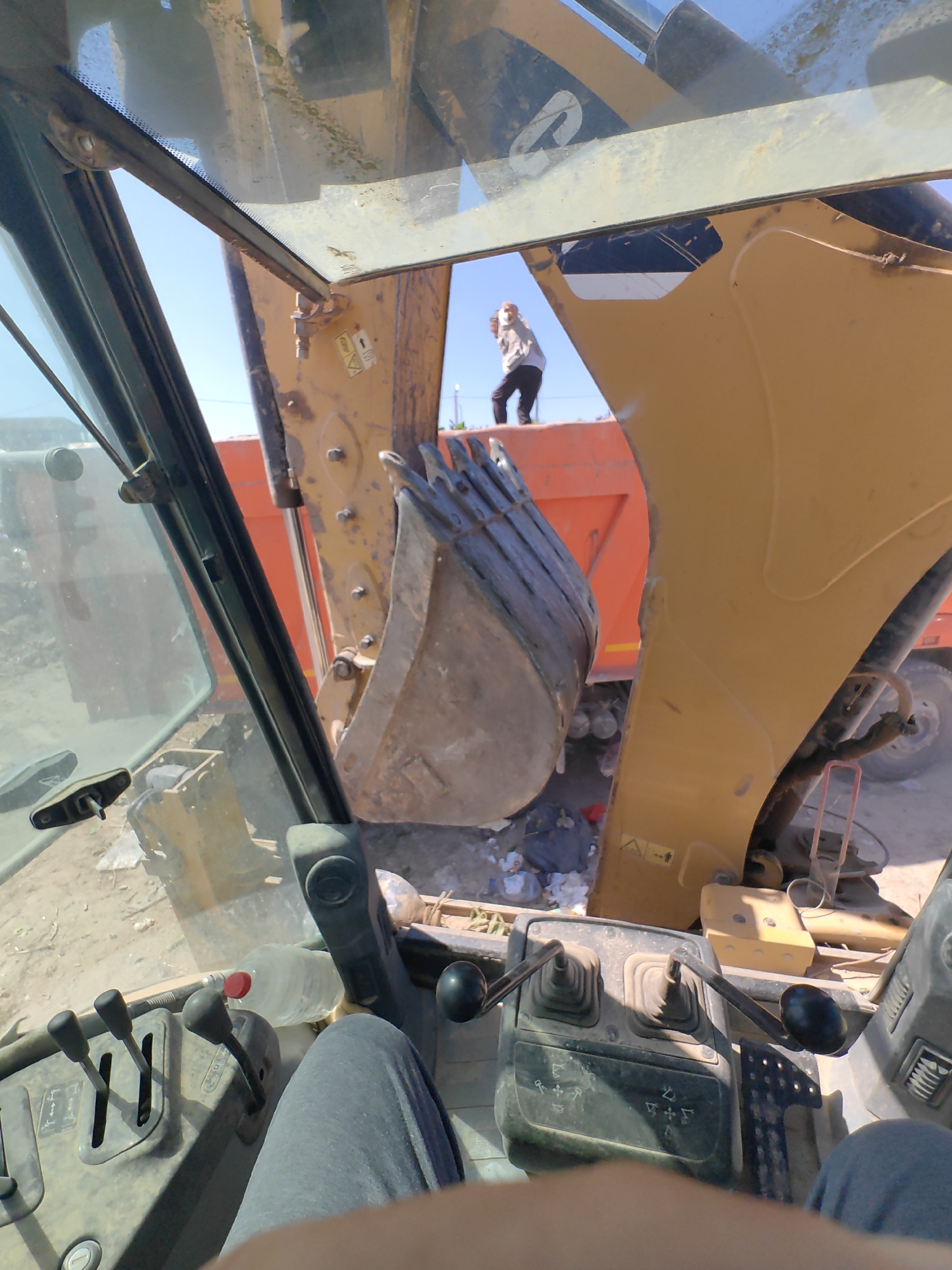 Heavy machinery clears debris at a Shymkent demolition site