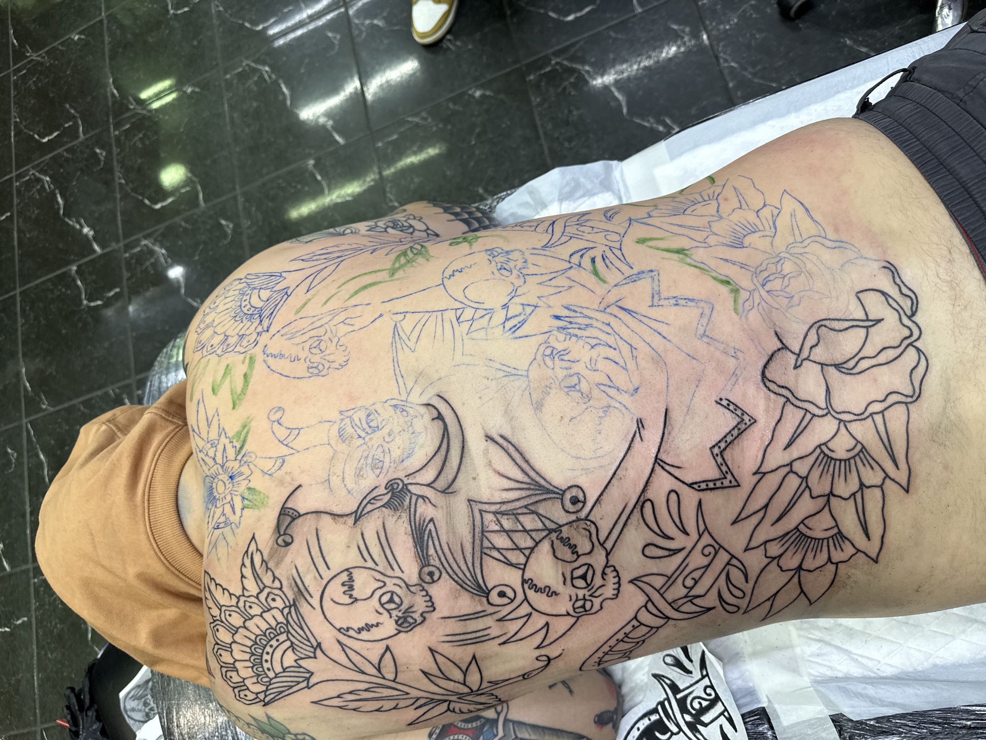 Tattooed individual observed resting in Moscow