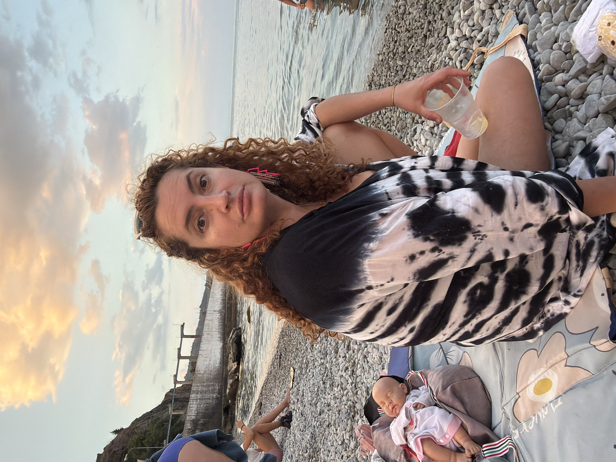 Lazy summer day at a Crimean beach and pier
