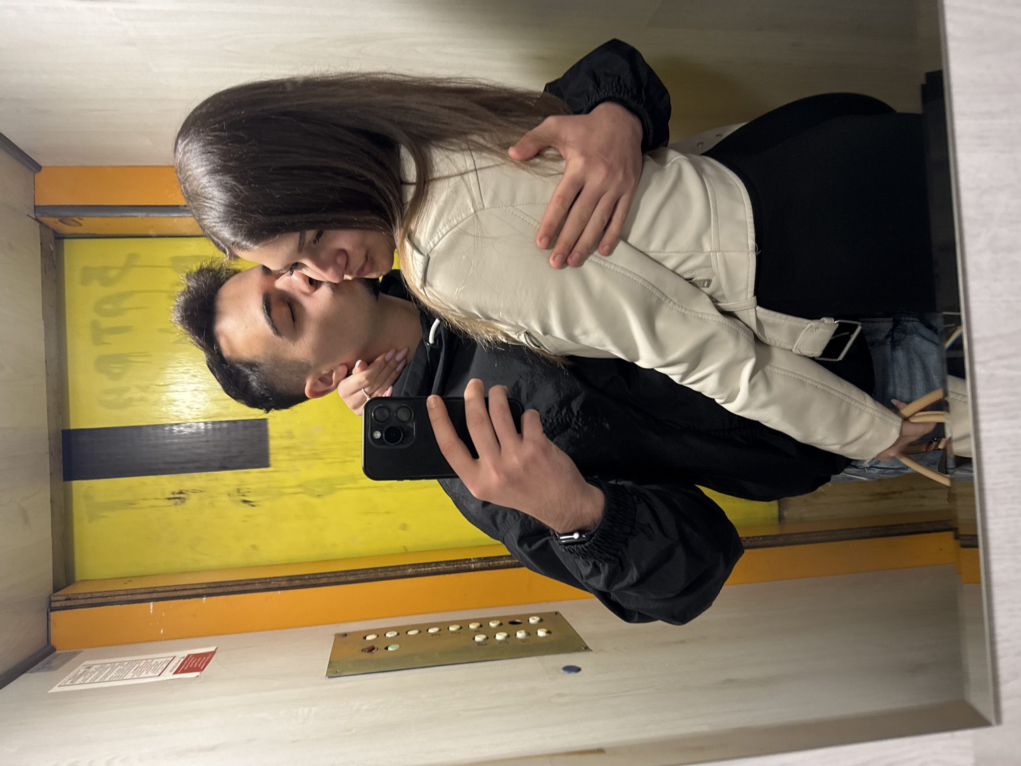 Couple Takes Mirror Selfie in Sofia Elevator