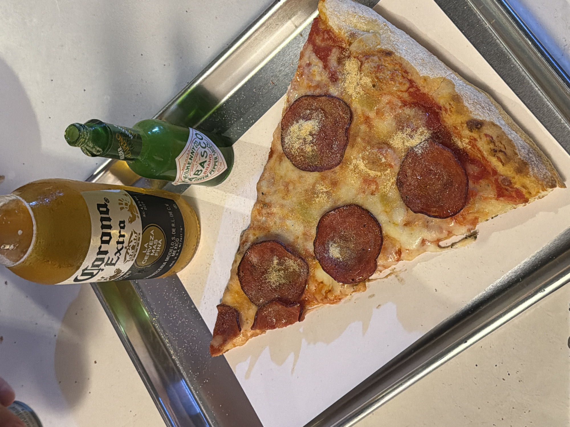 Pepperoni pizza and Corona at a Tel Aviv spot