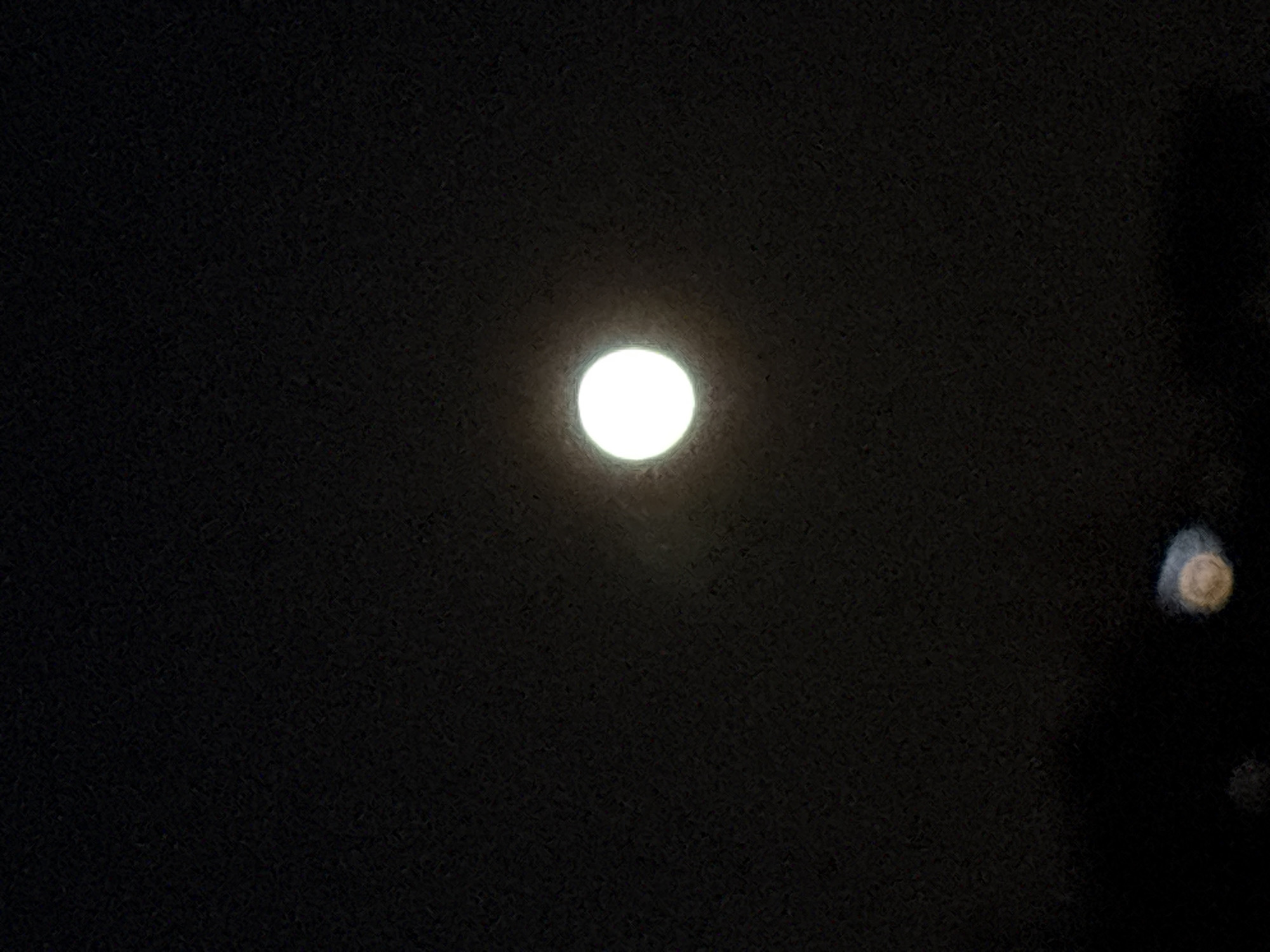 Bright moon observed in night sky over Chaykovsky, Russia