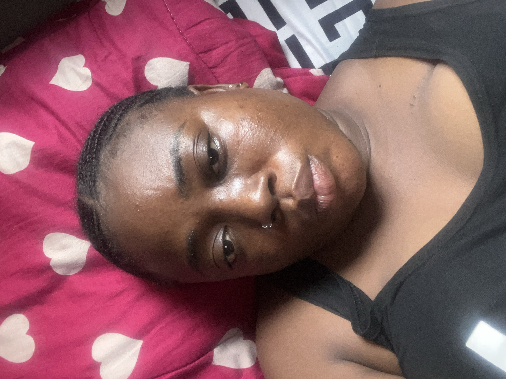 Woman photographs herself in bedroom with stuffed animal, Abuja