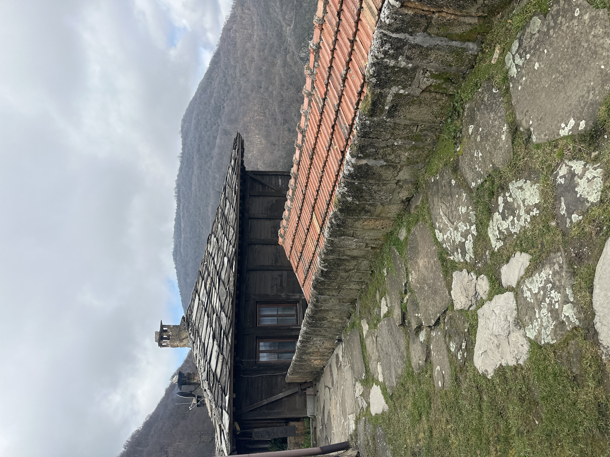Traditional village architecture and mountain views documented in Glozhene