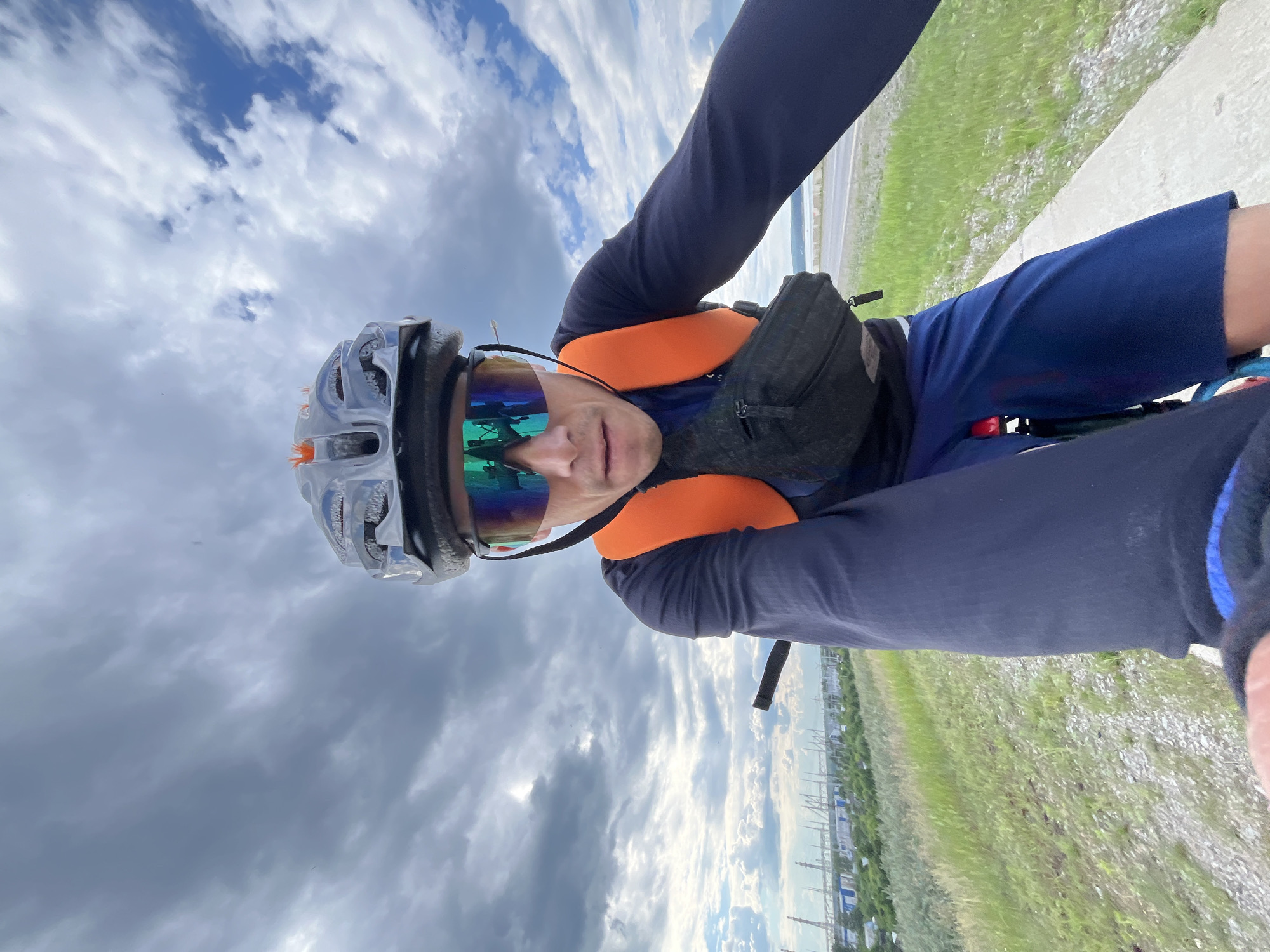 Cyclist in safety gear rides red bicycle in Chaikovsky