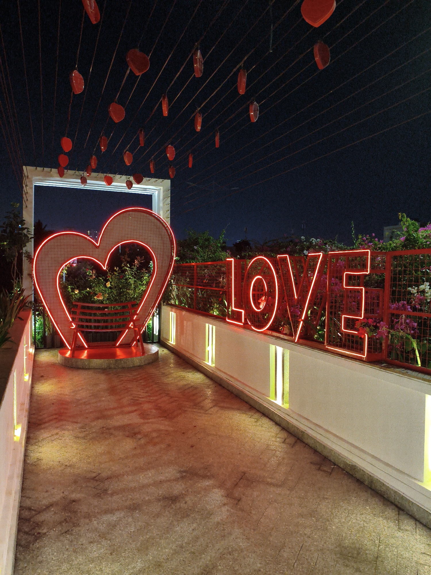 Red neon and heart decor light up a Nha Trang night venue