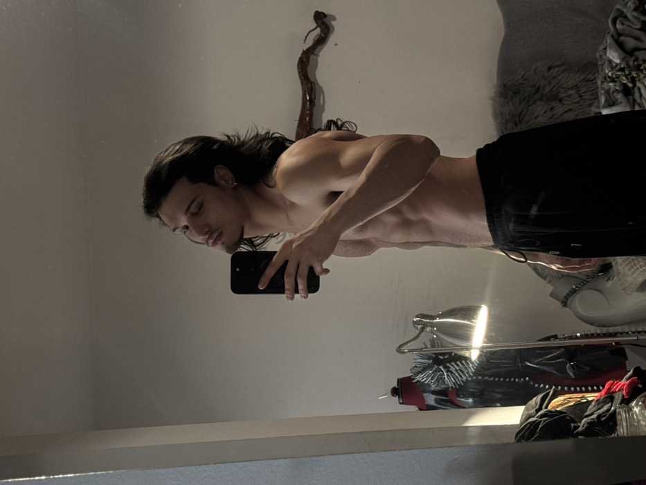 Young man photographed in multiple indoor poses in Sofia