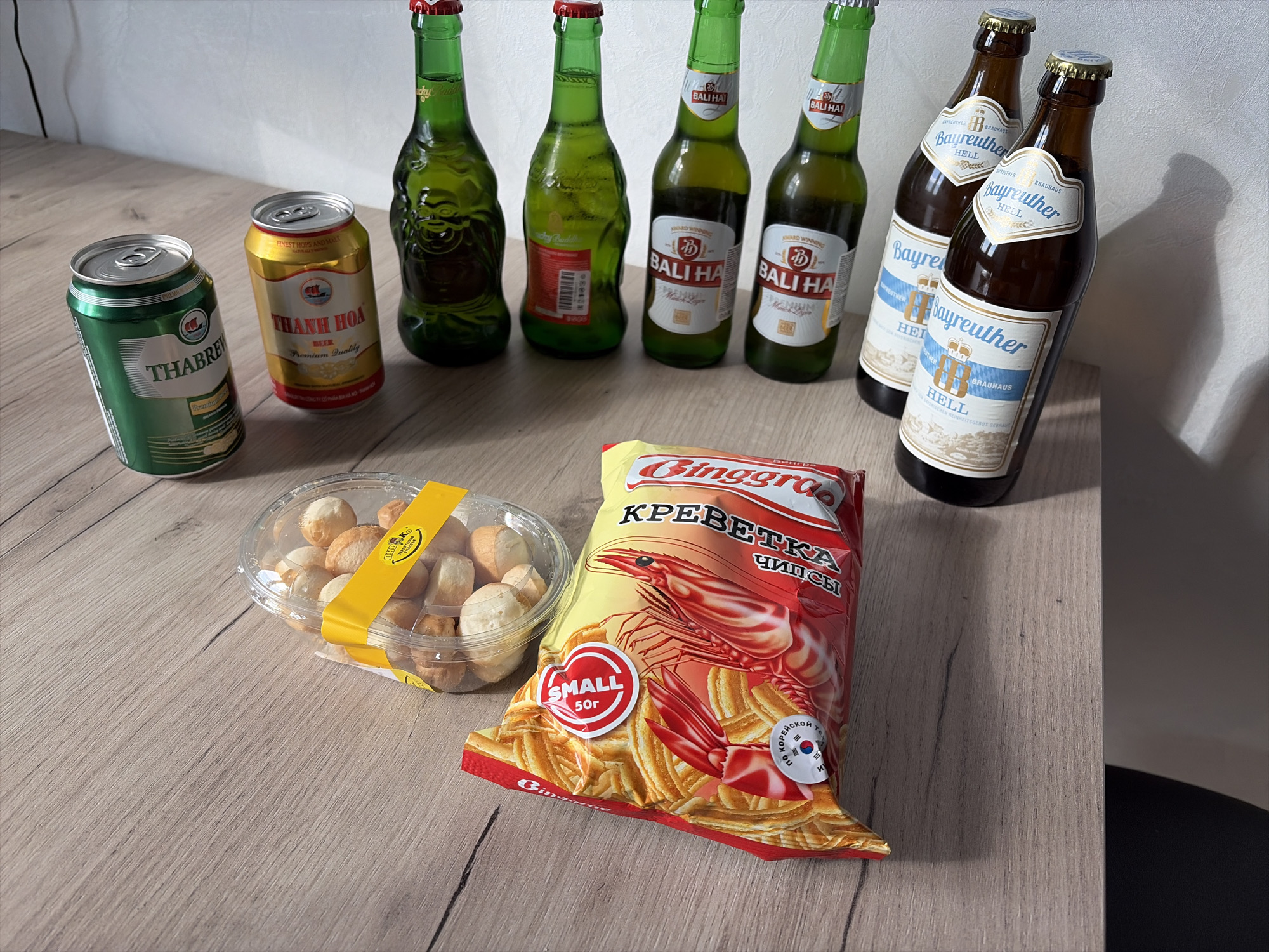 International beer lineup on a wooden table in Yekaterinburg