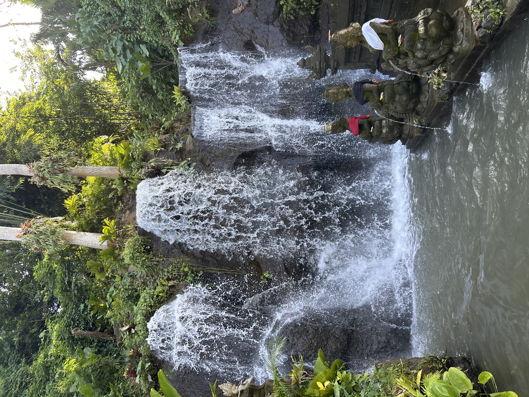 Traditional shrine statues documented at Sukawati waterfall, Indonesia