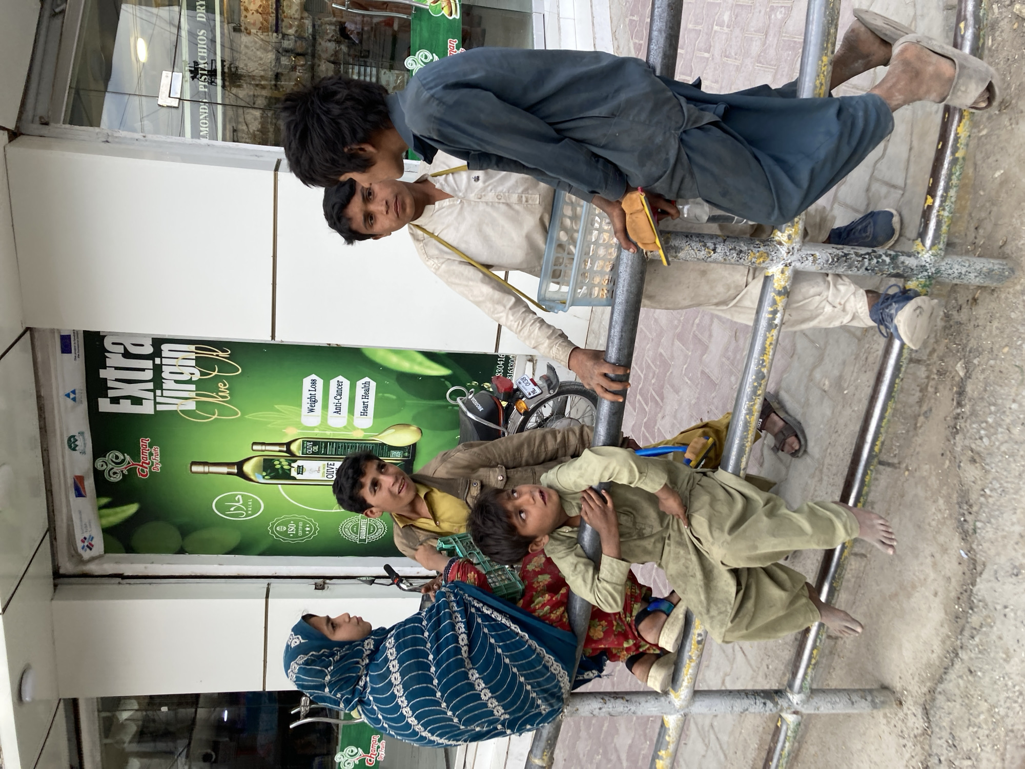 Family group interacts with metal structure in Quetta