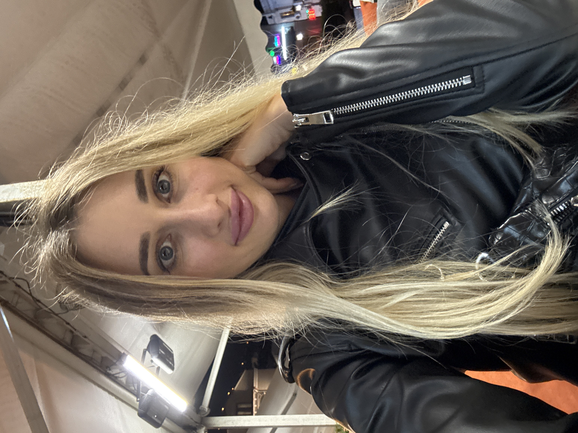 Woman takes selfie at indoor venue in Tbilisi