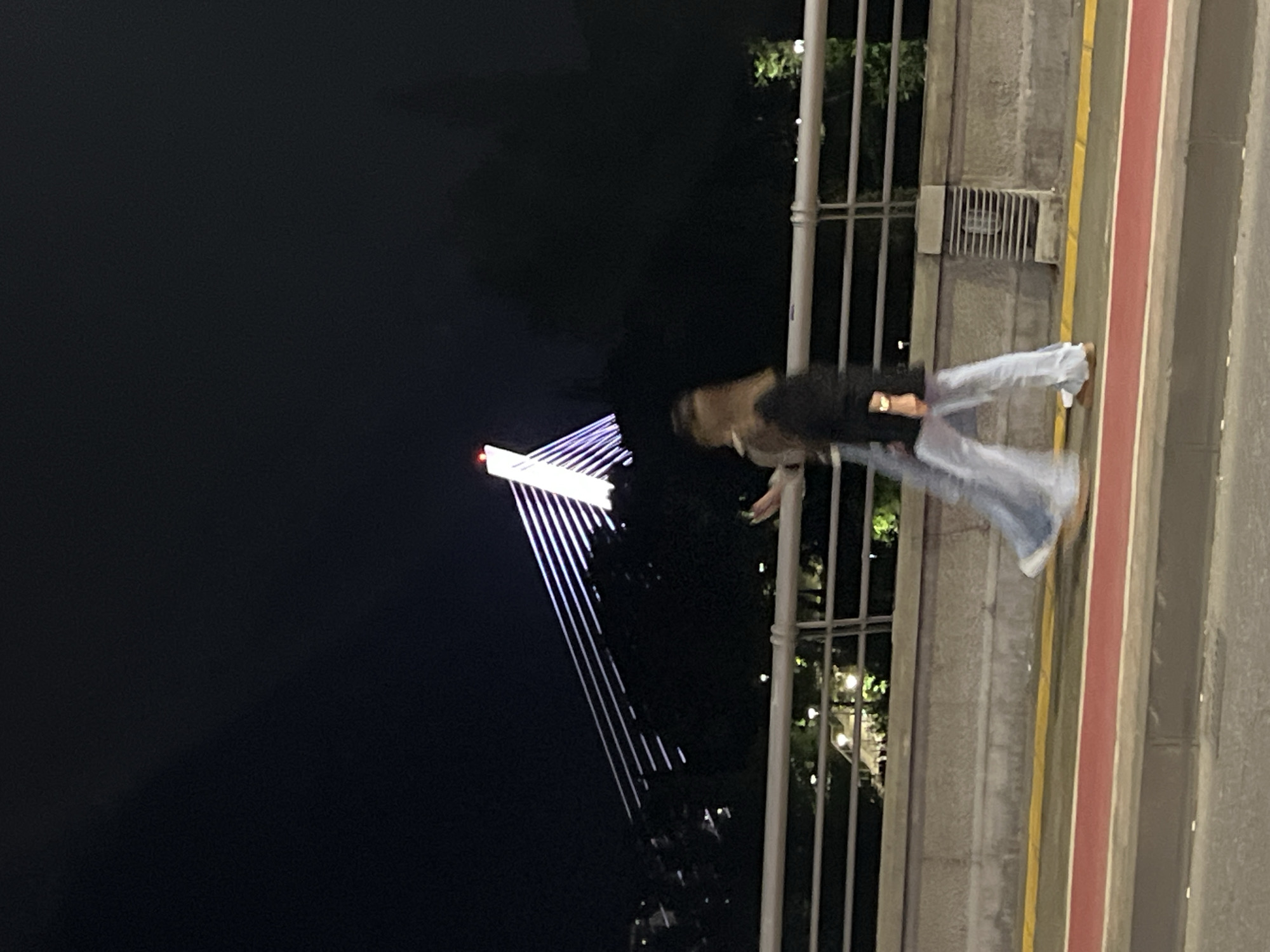 Person spotted near illuminated bridge in Podgorica nighttime