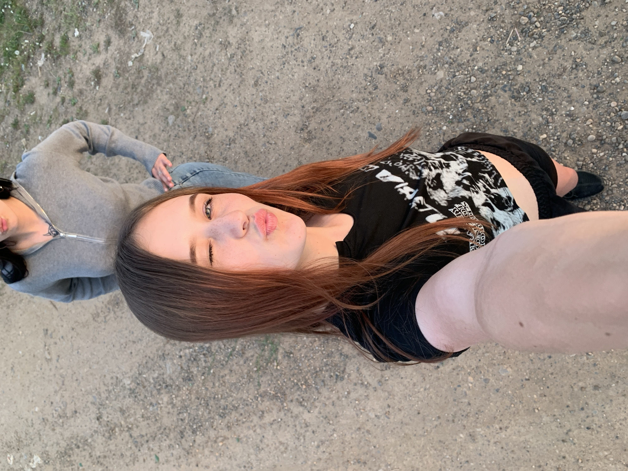 Young women take sunset selfies in Фоки, Russia