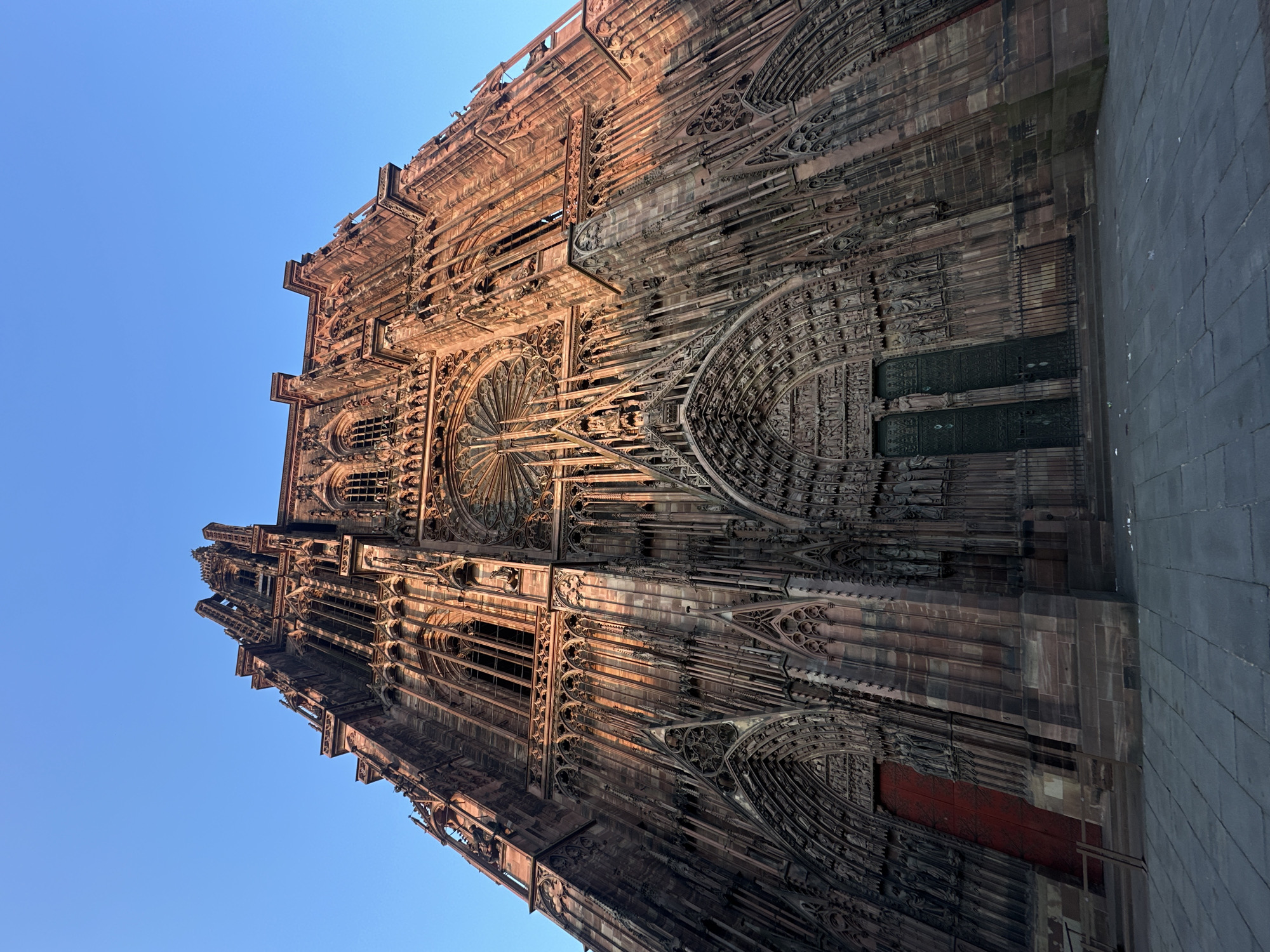 Tourist documents Strasbourg Cathedral, catches movie in theater