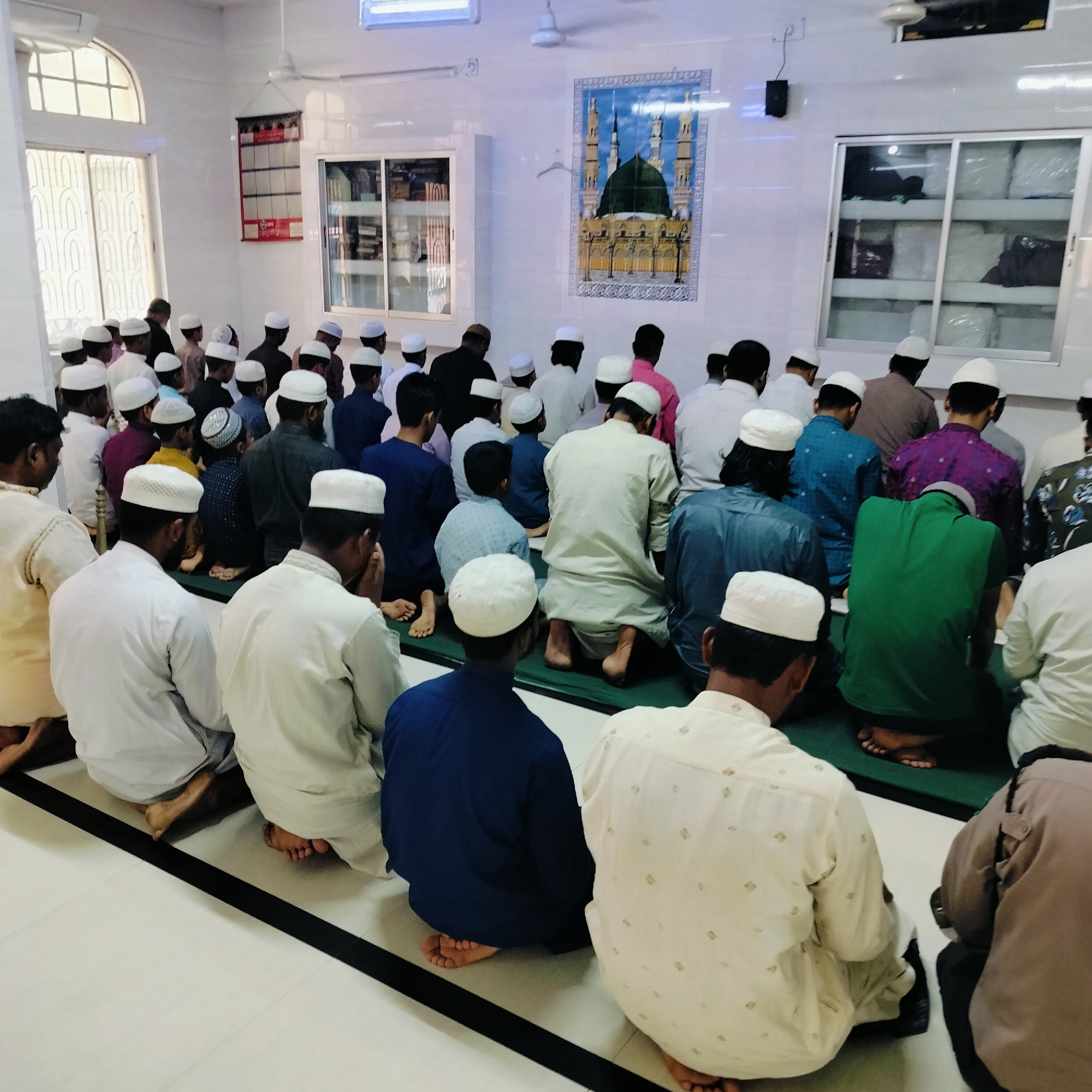 Group prayer session observed with 40 participants kneeling