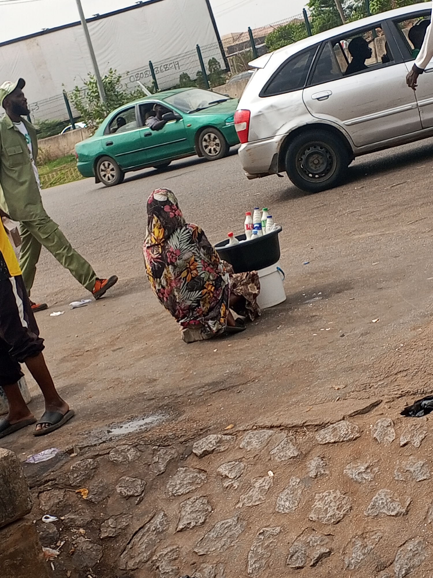 Daily street commerce captured along Abuja roadside