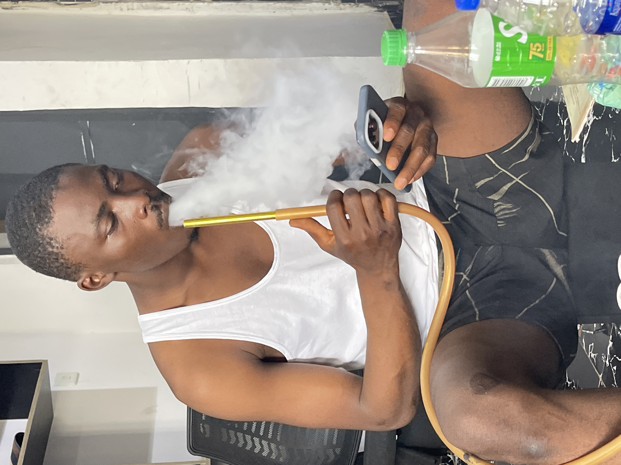 Hookah session indoors in Abuja, caught from multiple angles