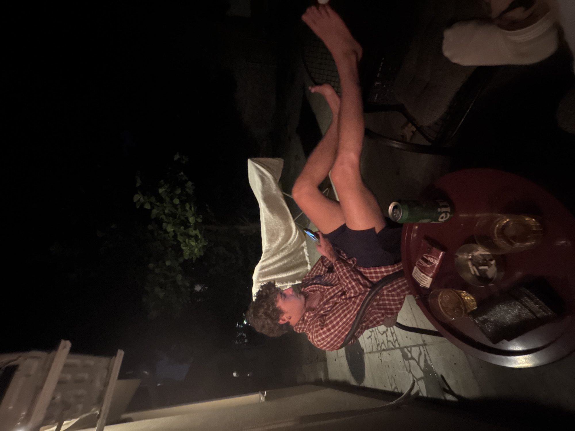 Late night in a Belgrade courtyard, drinks and cigarettes