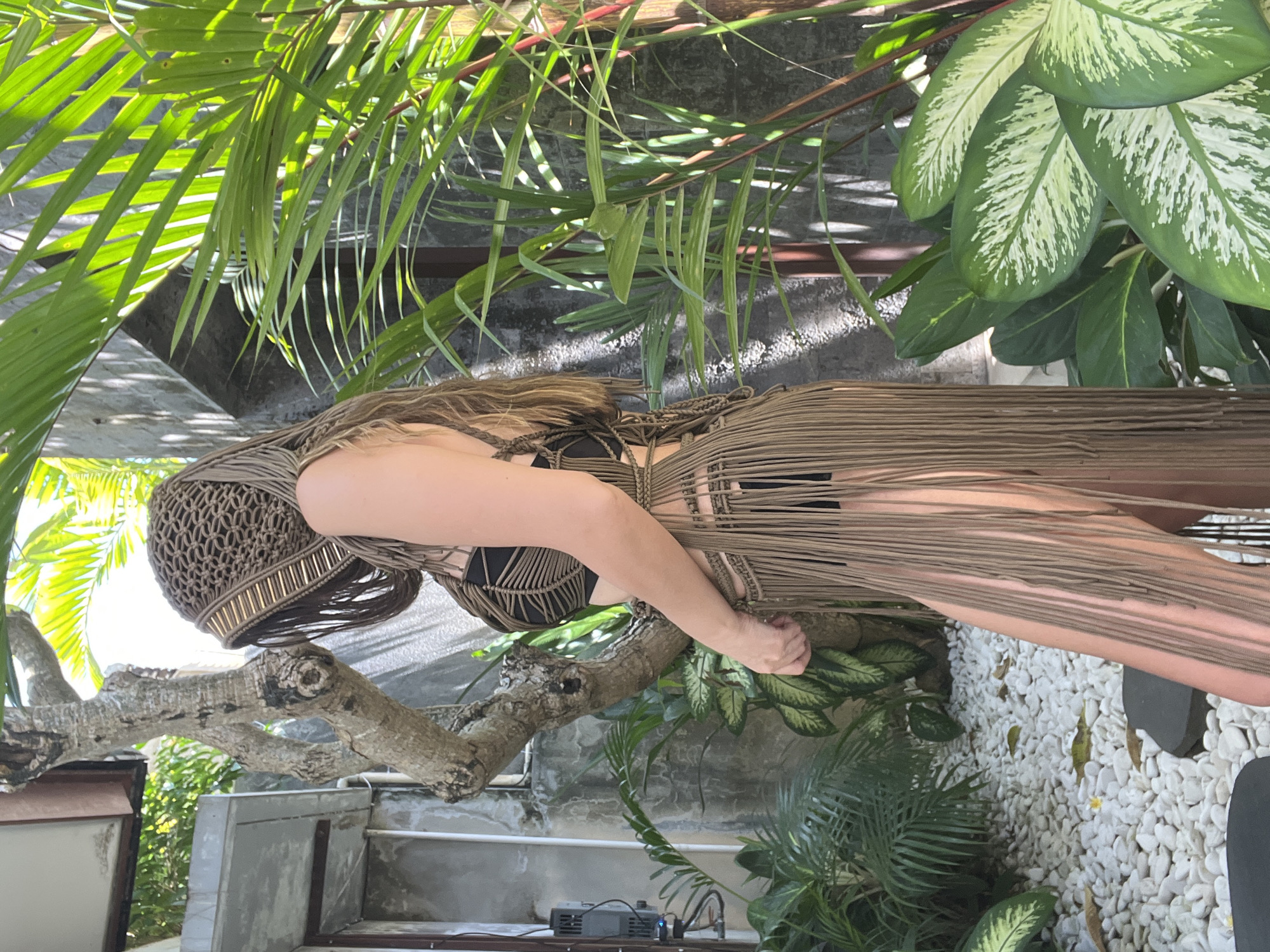 Woman photographed in macrame dress at North Kuta resort