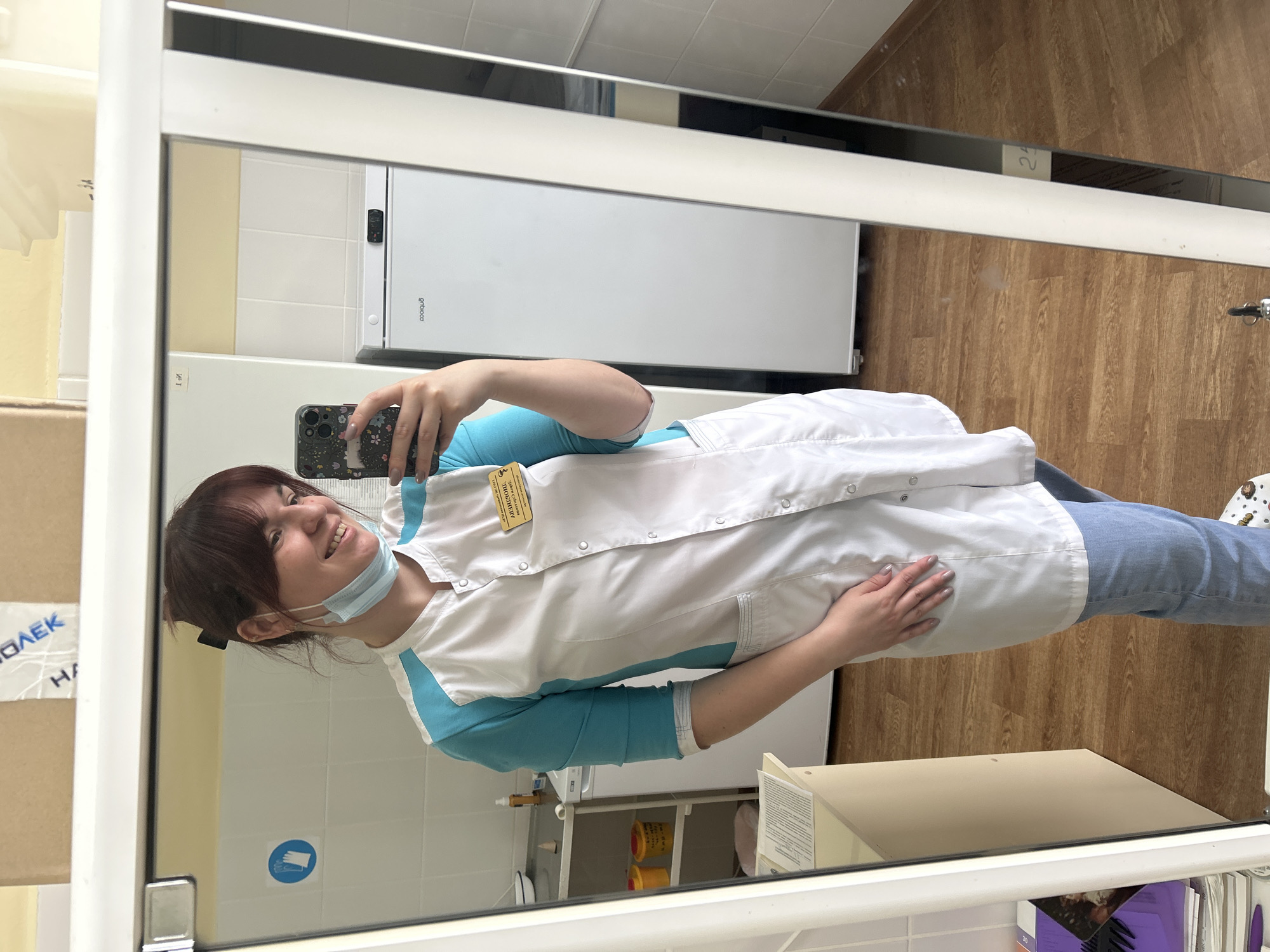 Medical worker takes playful selfies with chocolate during shift