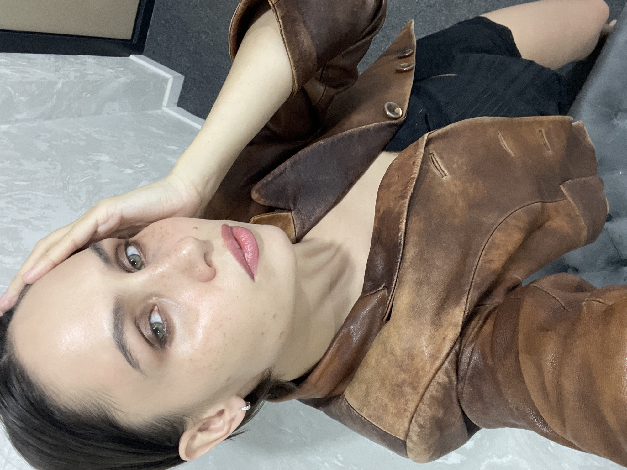 Woman photographed in leather jacket, two poses, Izhevsk