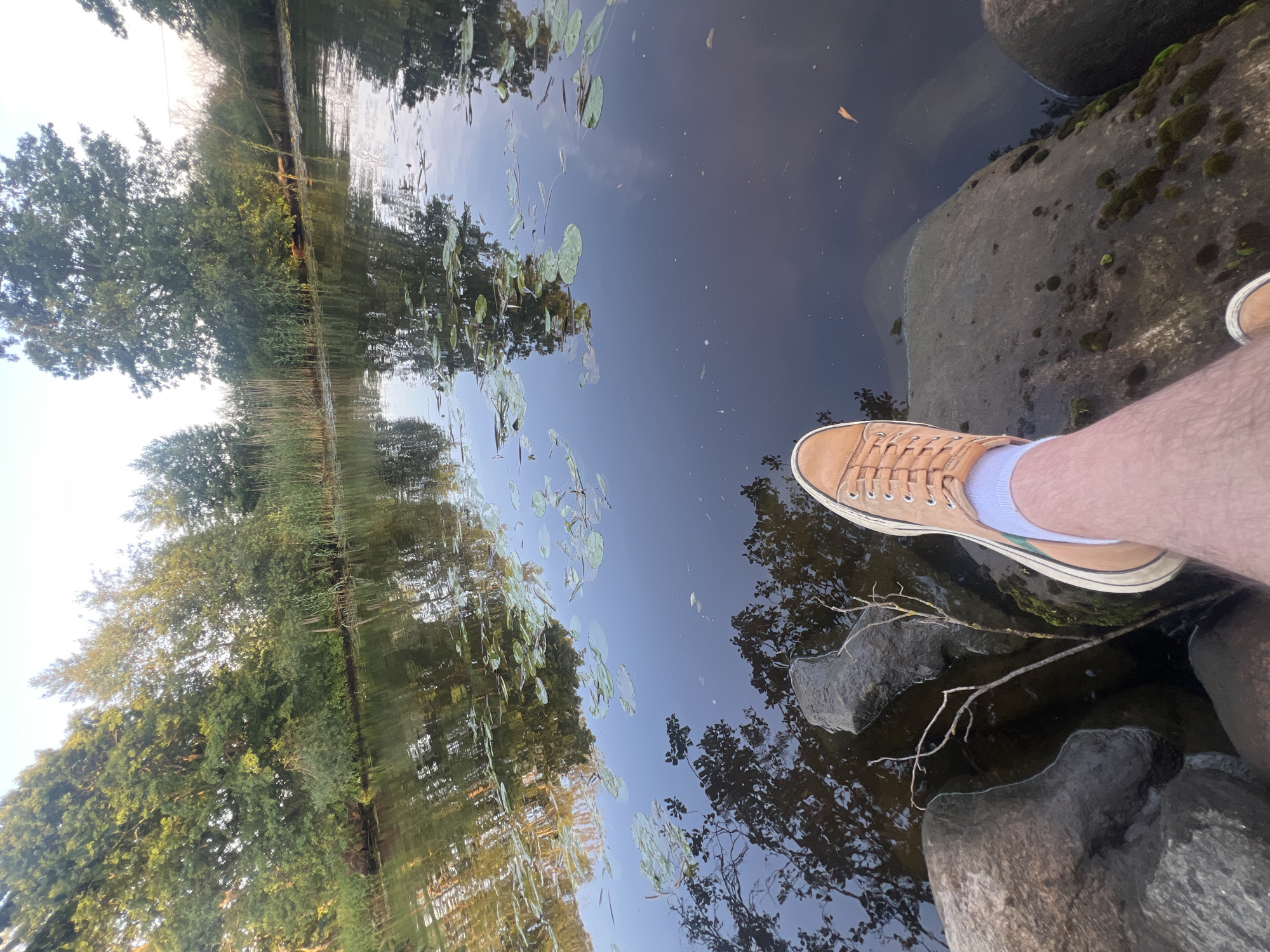 Lazy afternoon boating on a calm Lithuanian waterway